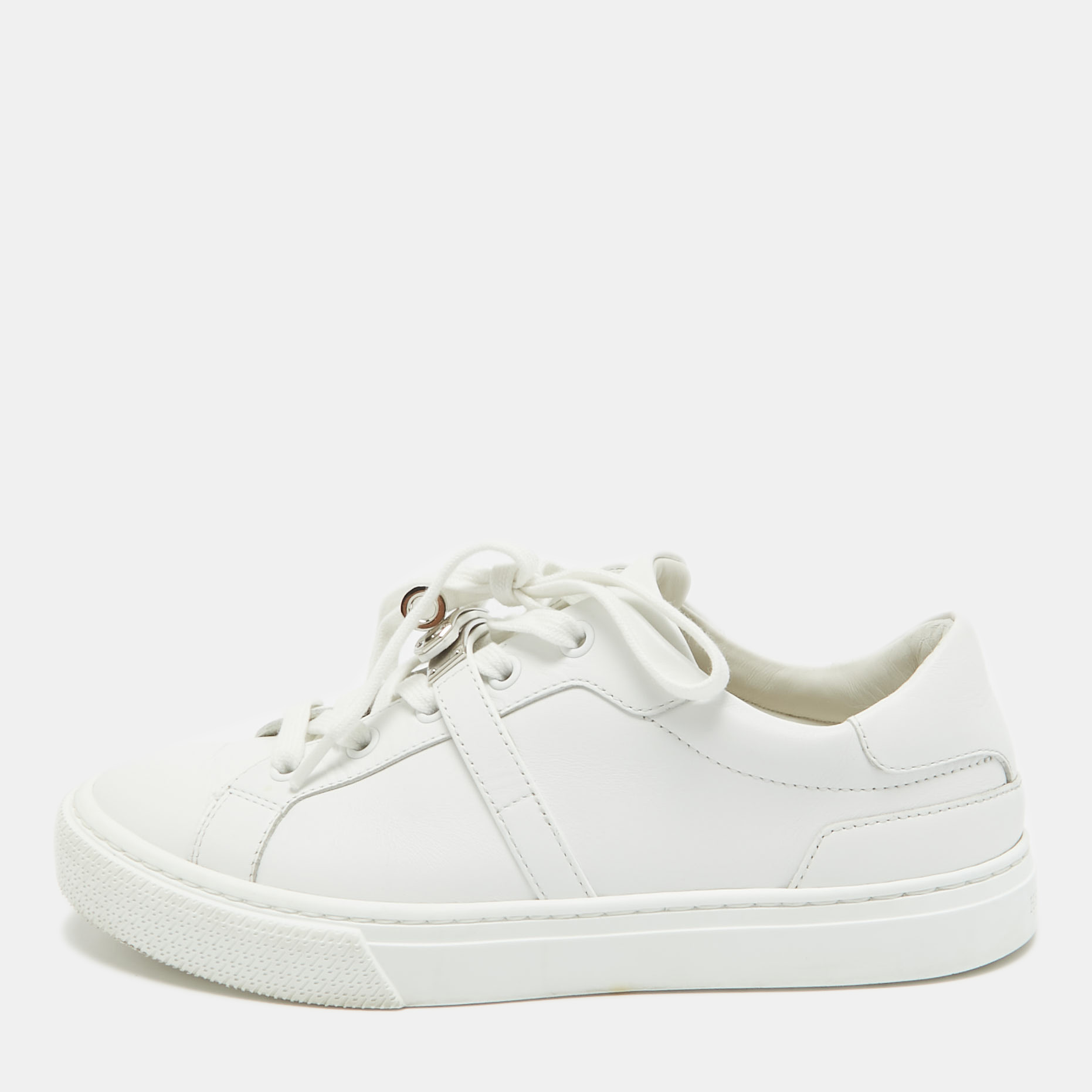 How chic are these Hermès sneakers flaunting a white exterior Theyve been made using luxe leather into a low top design and have lace ups silver tone lock detailing comfy insoles and durable soles. Team them with your casual dresses and jeans.