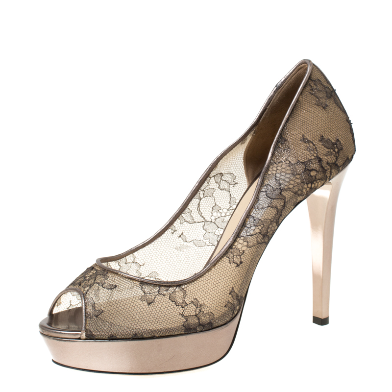It is easy to fall in love with these pumps by Jimmy Choo Theyve been beautifully covered in lace and designed with peep toes platforms and 12 cm heels. The pumps are sure to complement all your dresses and evening gowns.