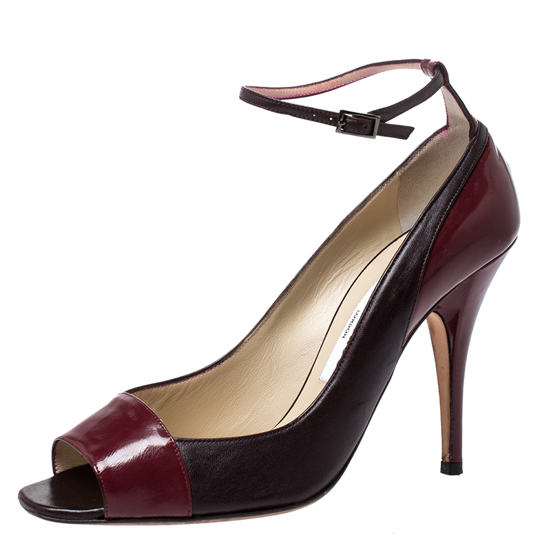 Elevate your look by flaunting these pumps crafted from premium quality leather and patent leather. This Jimmy Choo pair is styled with peep toes towering stiletto heels and ankle fastenings. Add a touch of sophistication to your ensemble by wearing this pair of elegant burgundy pumps.
