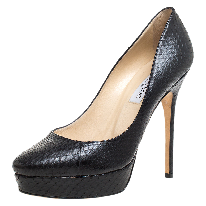 You can never go wrong with these classic pumps by Jimmy Choo. Crafted in Italy they are made from exotic python leather. They come in a lovely shade of black that is stylish and versatile. They are styled with almond toes 13 cm heels platforms sculpted top line leather lining insoles and soles. Grab these now