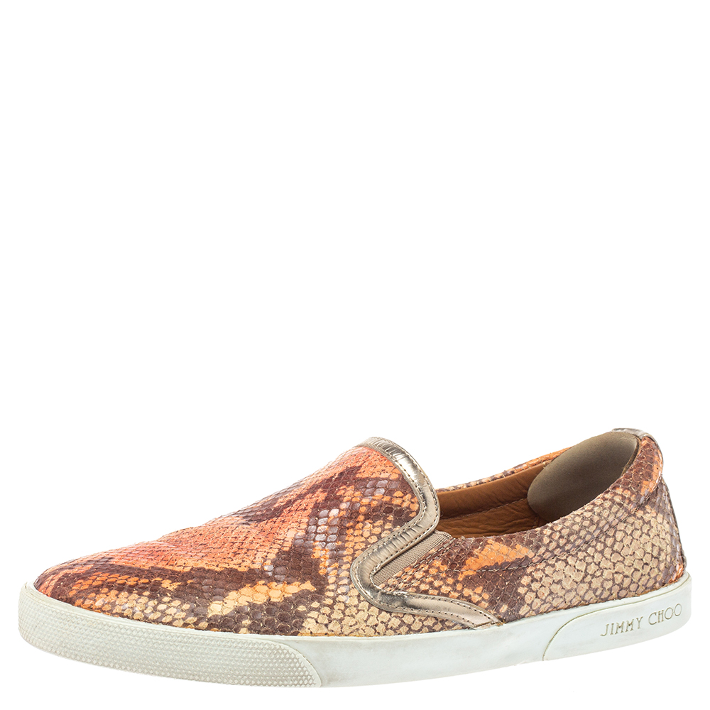 Comfort brews with style in these catchy slip on sneakers by Jimmy Choo. Crafted in snakeskin embossed leather these look sophisticated in brown. Insoles are leather lined. Wear these Brooklyn sneakers with casuals for a look that is funky and stylish.