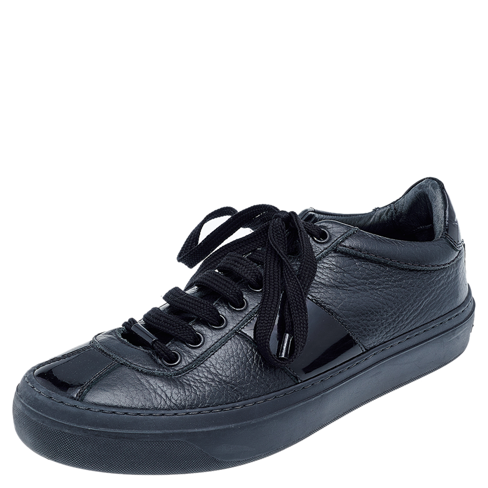 These sneakers from Jimmy Choo offer the best of comfort. They are designed in a low top profile using leather and patent leather. Finished with lace ups and the label on the heels this pair is perfect to be worn all day.