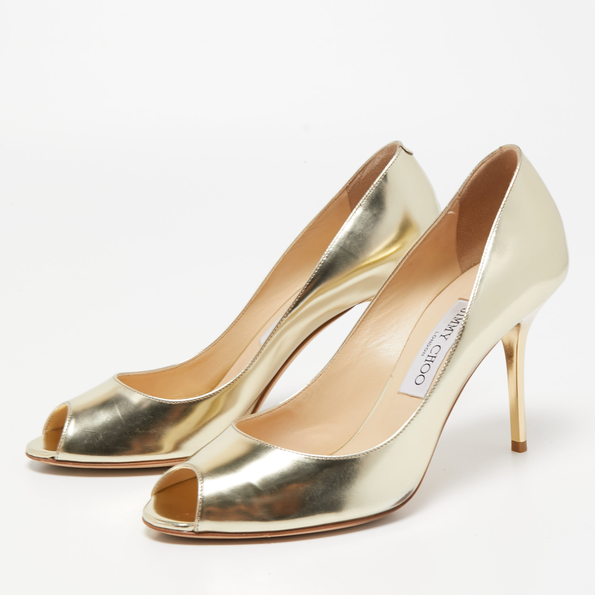 

Jimmy Choo Gold Leather Evelyn Peep Toe Pumps Size