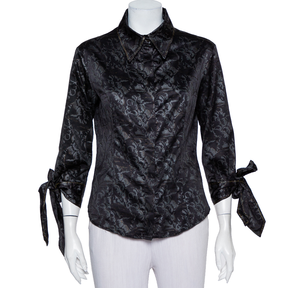 Highlighting the best trends of the season this top is from Just Cavalli. This chic black shirt exhibits a well balanced combination of comfort and vogue in its design. Cut from satin this posh top is fine great for evening events.