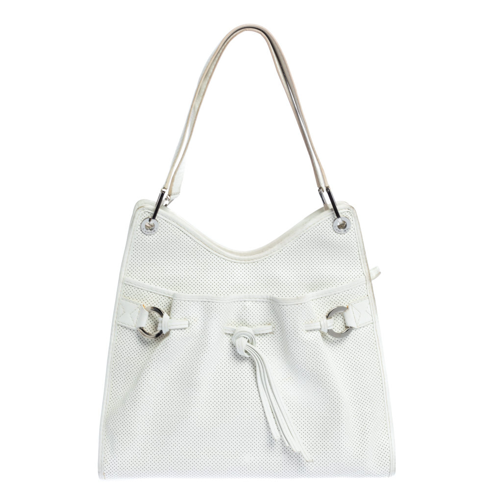 Featuring a trendy silhouette this Lancel bag is crafted from durable leather and secured with a zipper. It comes with dual shoulder handles drawstring detailing and silver tone hardware. Its nylon lined interior can easily hold all your essentials.