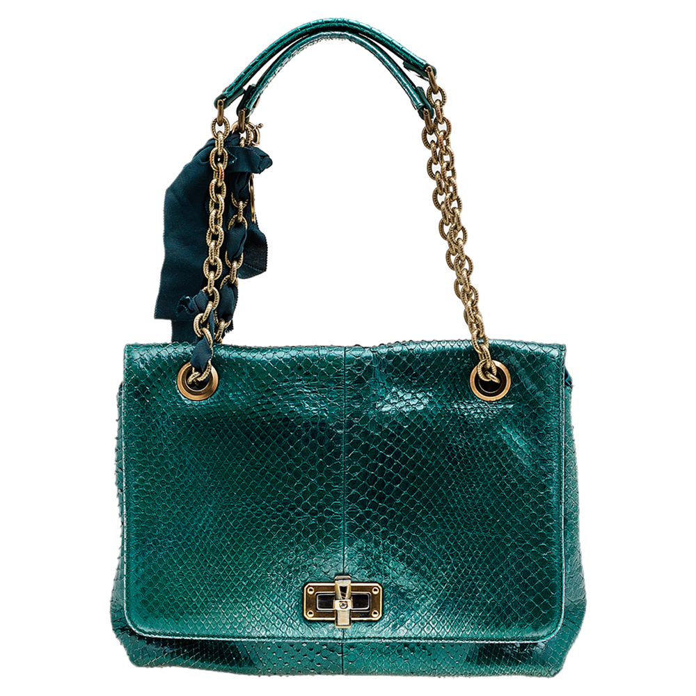 Crafted to offer uniqueness and exceptionality this shoulder bag from Lanvin will help you obtain an exquisite look. It is designed using sea green python leather on the exterior and comes with gold toned accents. Look stylish for the day as you carry this extraordinary Lanvin bag.