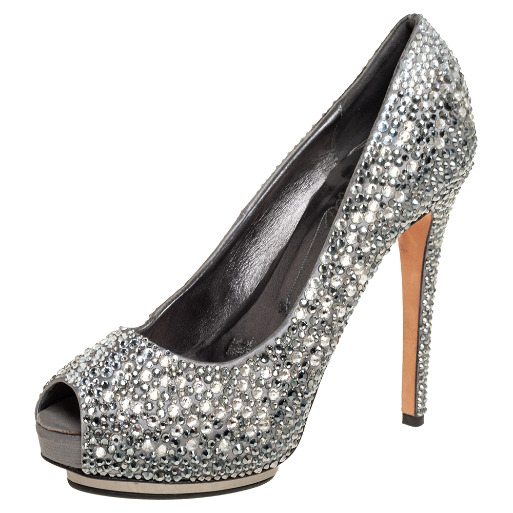 Le Sillas opulent aesthetic and stellar craftsmanship in shoemaking is evident in these stunning pumps. Crafted from satin in a grey shade these pumps feature peep toes slender heels and crystal covered exteriors.