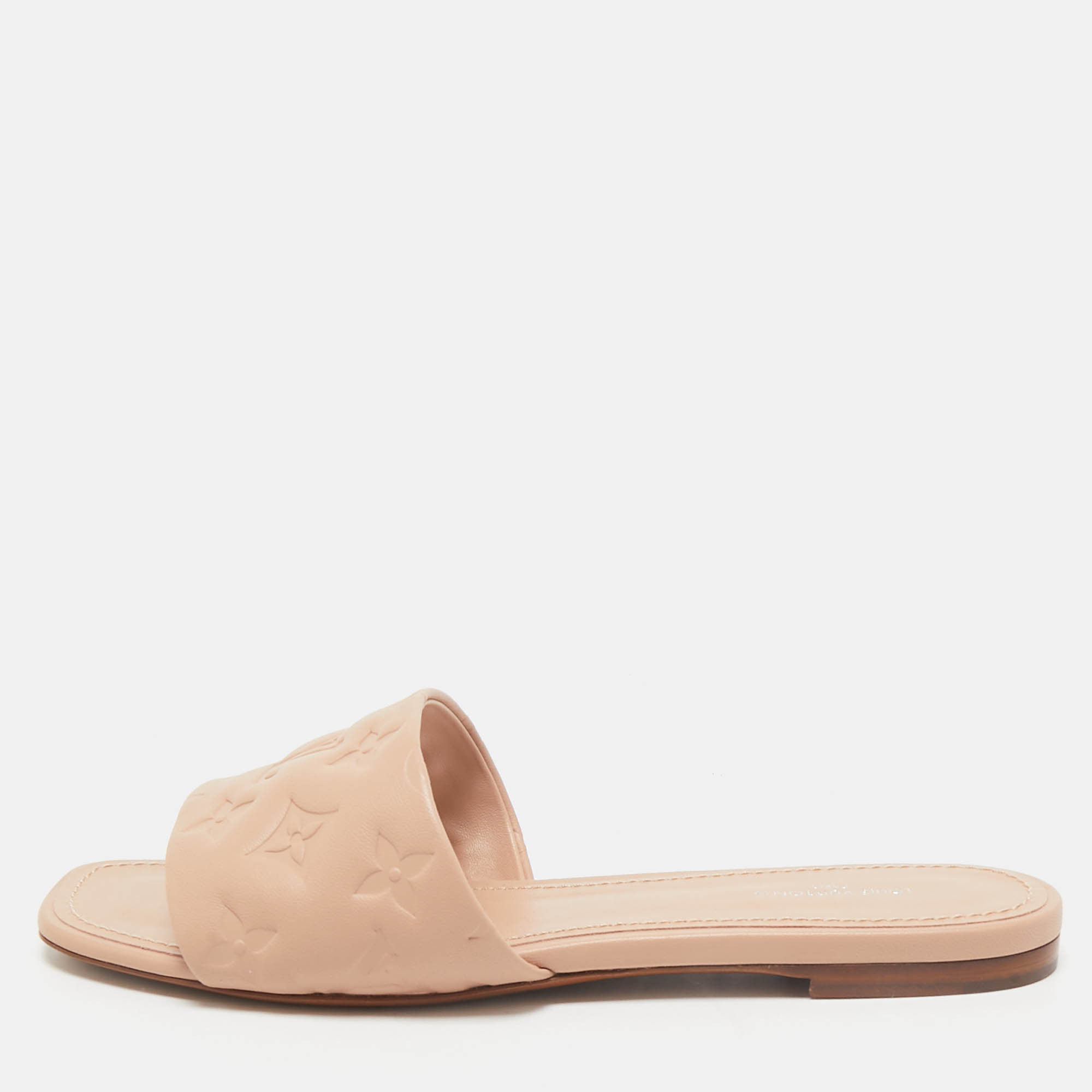 

Louis Vuitton Beige Monogram Embossed Leather Revival Flat Slides Size
