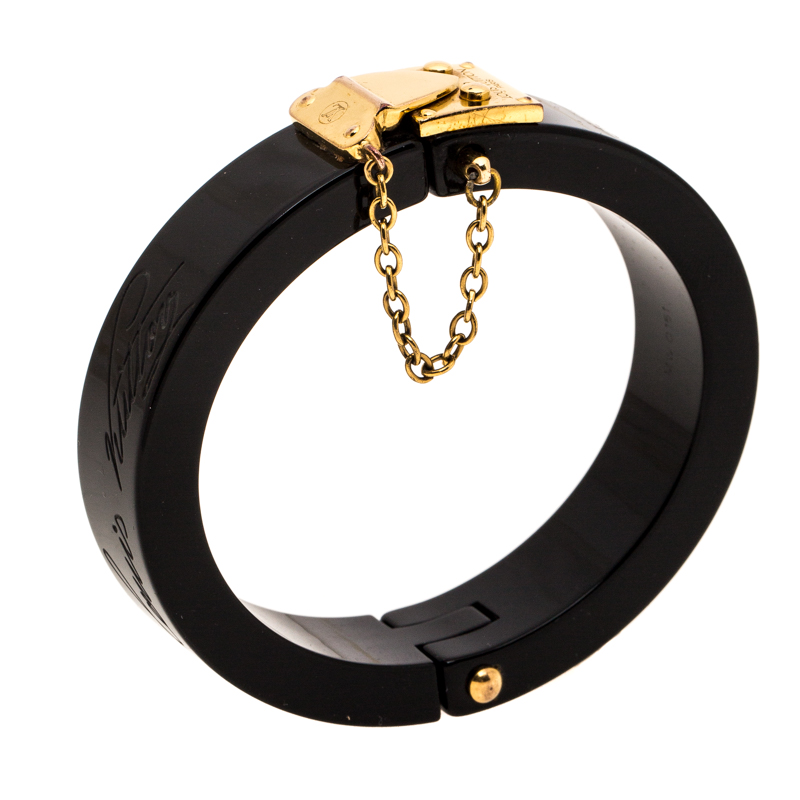 

Louis Vuitton Lock Me Black Resin Gold Tone Hinged Bracelet