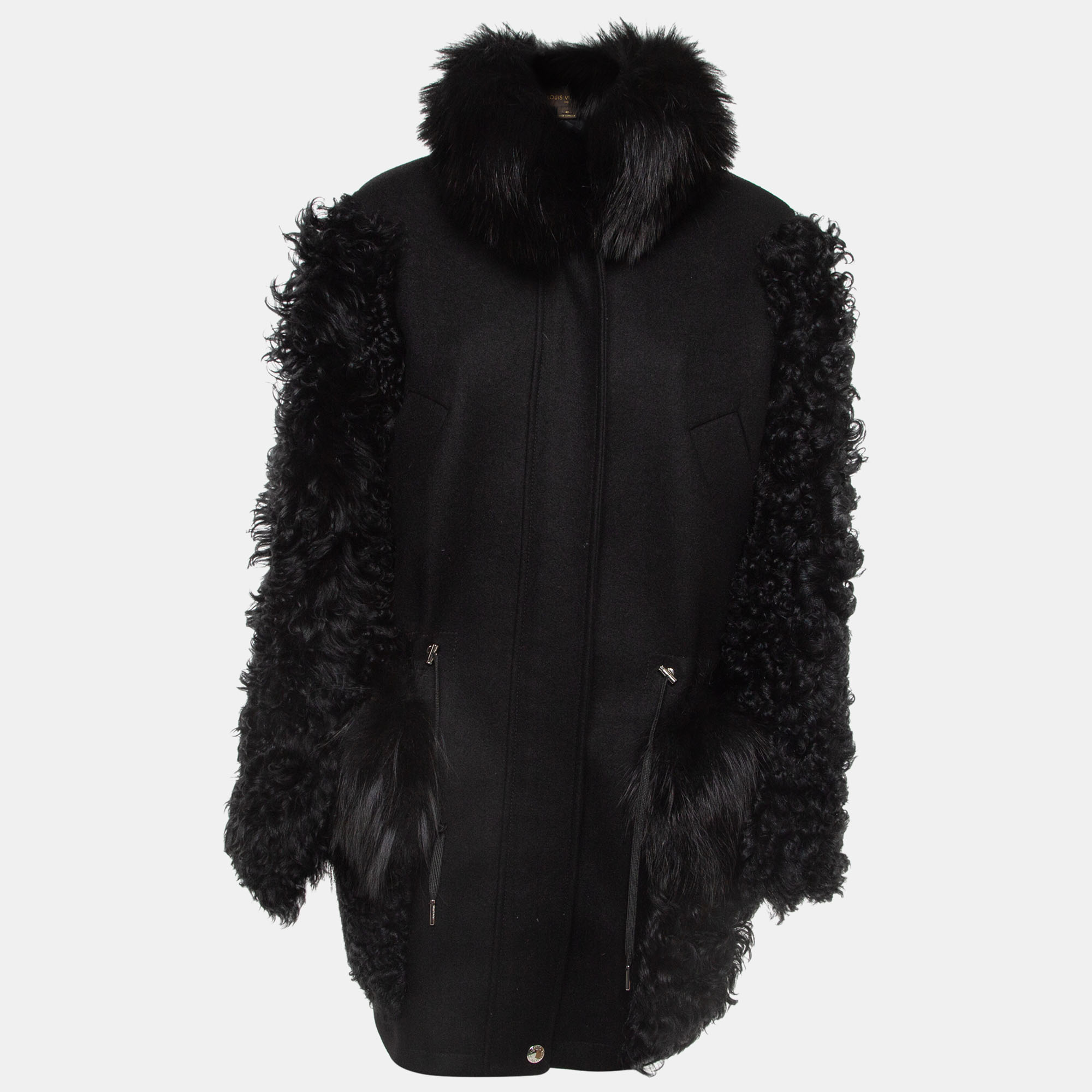 Crafted from compact cashmere and fur this easy but chic outerwear piece perfectly blends luxury and functionality. Embellished with beaver shearling and fox patchwork pockets a fox collar and sleeves in black shearling it can be cinched at the waist for a more feminine silhouette.