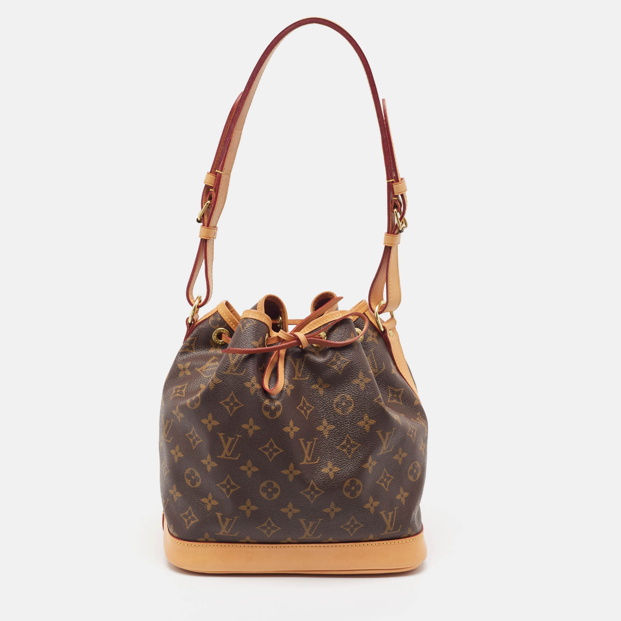 Created in 1932 by Louis Vuitton to carry bottles of Champagne the iconic Noe now serves as a stylish daytime handbag. Crafted from monogram canvas the bag exudes just the right amount of sophistication. It has a single adjustable strap with gold tone buckles a drawstring fastening and a canvas lined interior. This piece is definitely an ideal buy