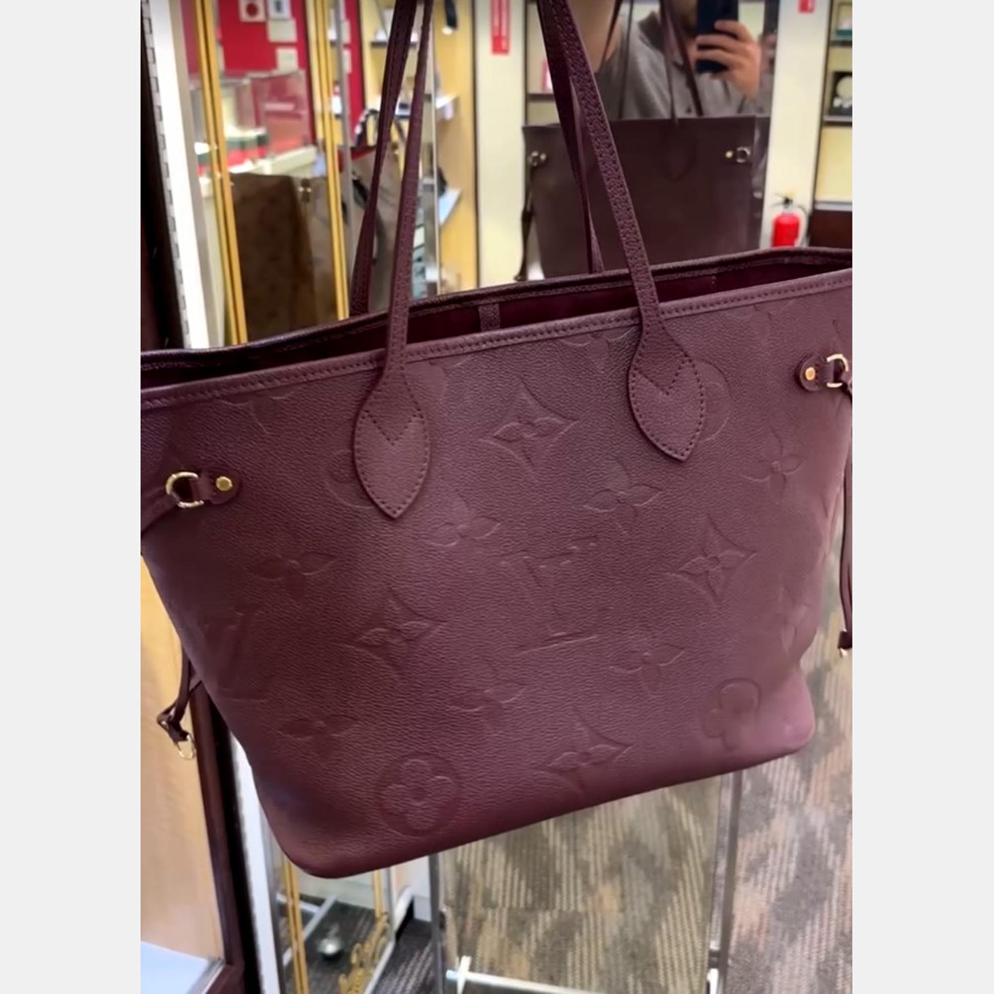 

Louis Vuitton Monogram Empreinte Neverfull MM Bag, Burgundy