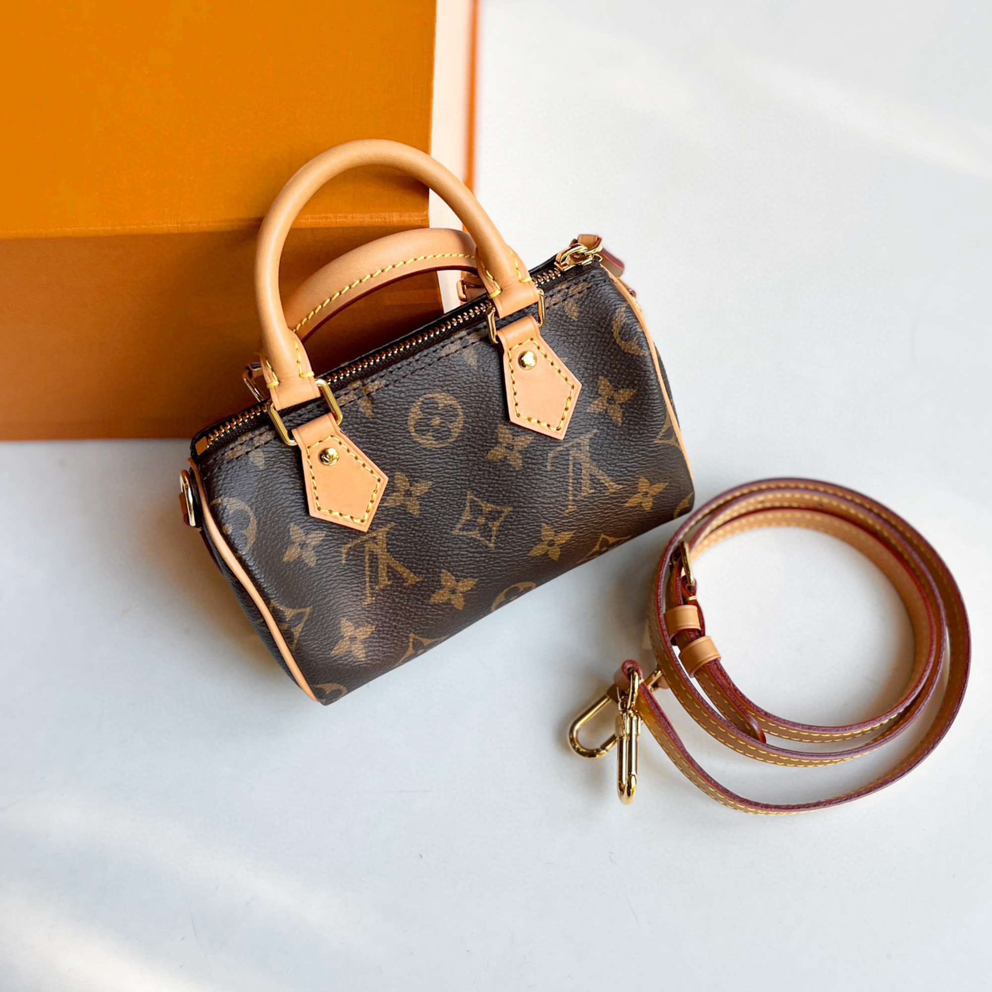 

Louis Vuitton Monogram Canvas Speedy Nano Bag, Brown