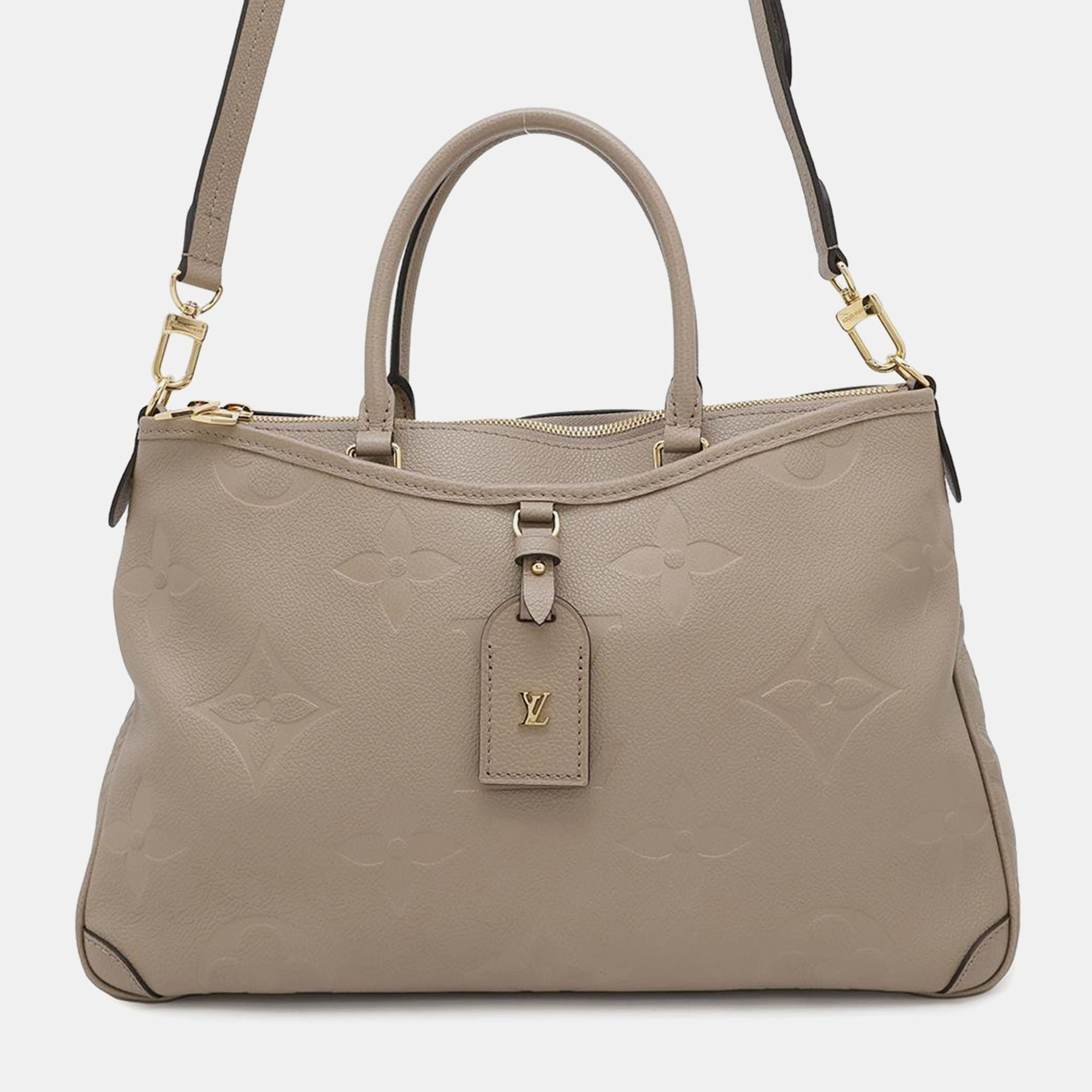 

Louis Vuitton Tourterelle Monogram Empreinte Leather Trianon MM Tote Bag, Beige