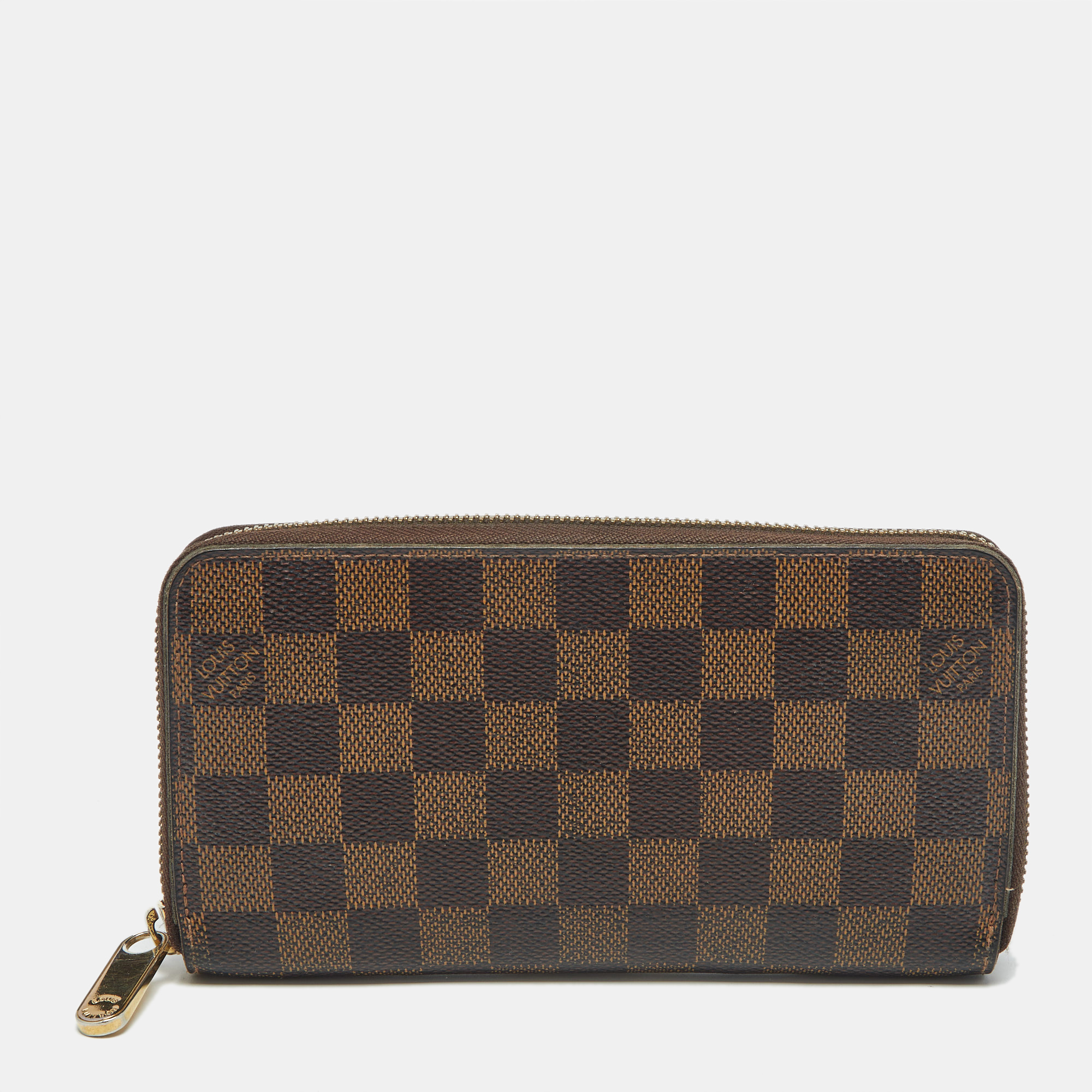Pre-owned Louis Vuitton Damier Ebene Canvas Zippy Wallet In Brown