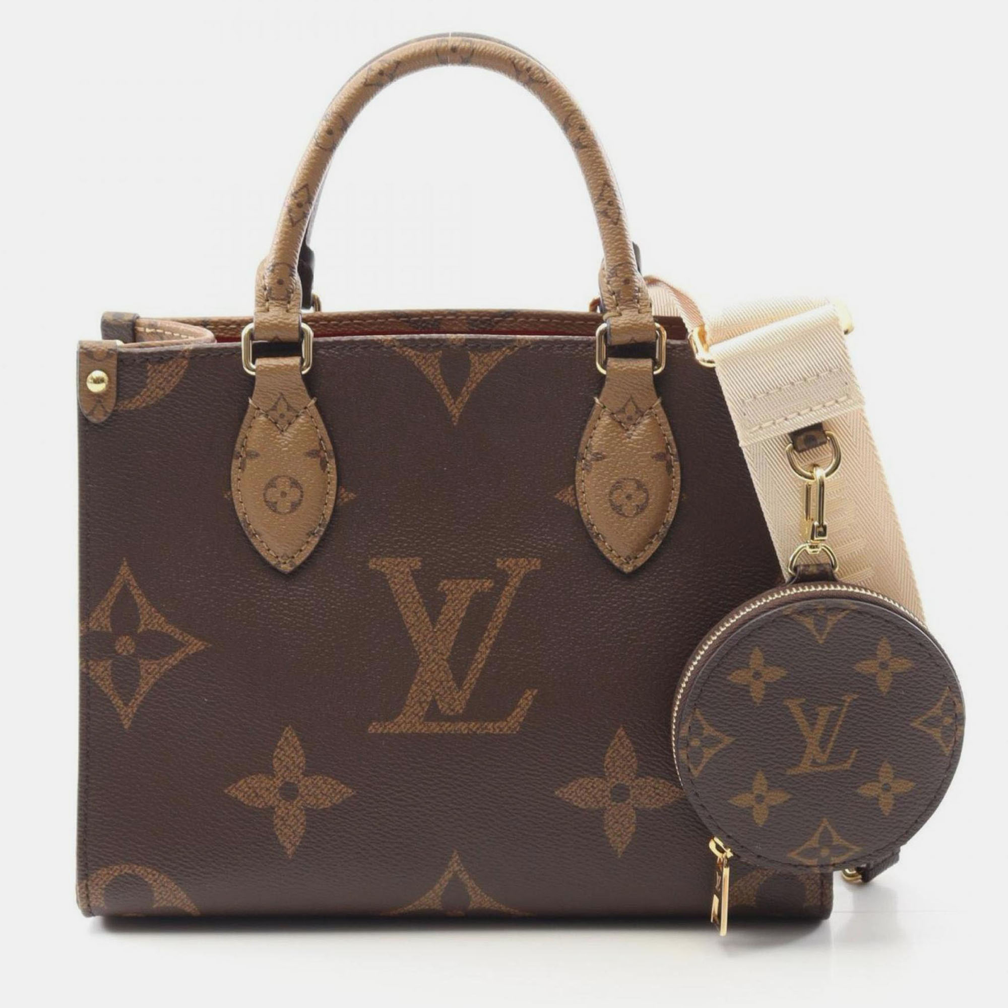 

Louis Vuitton On The Go Pm Handbag In Coated Canvas With Monogram Giant Reverse Brown And Beige