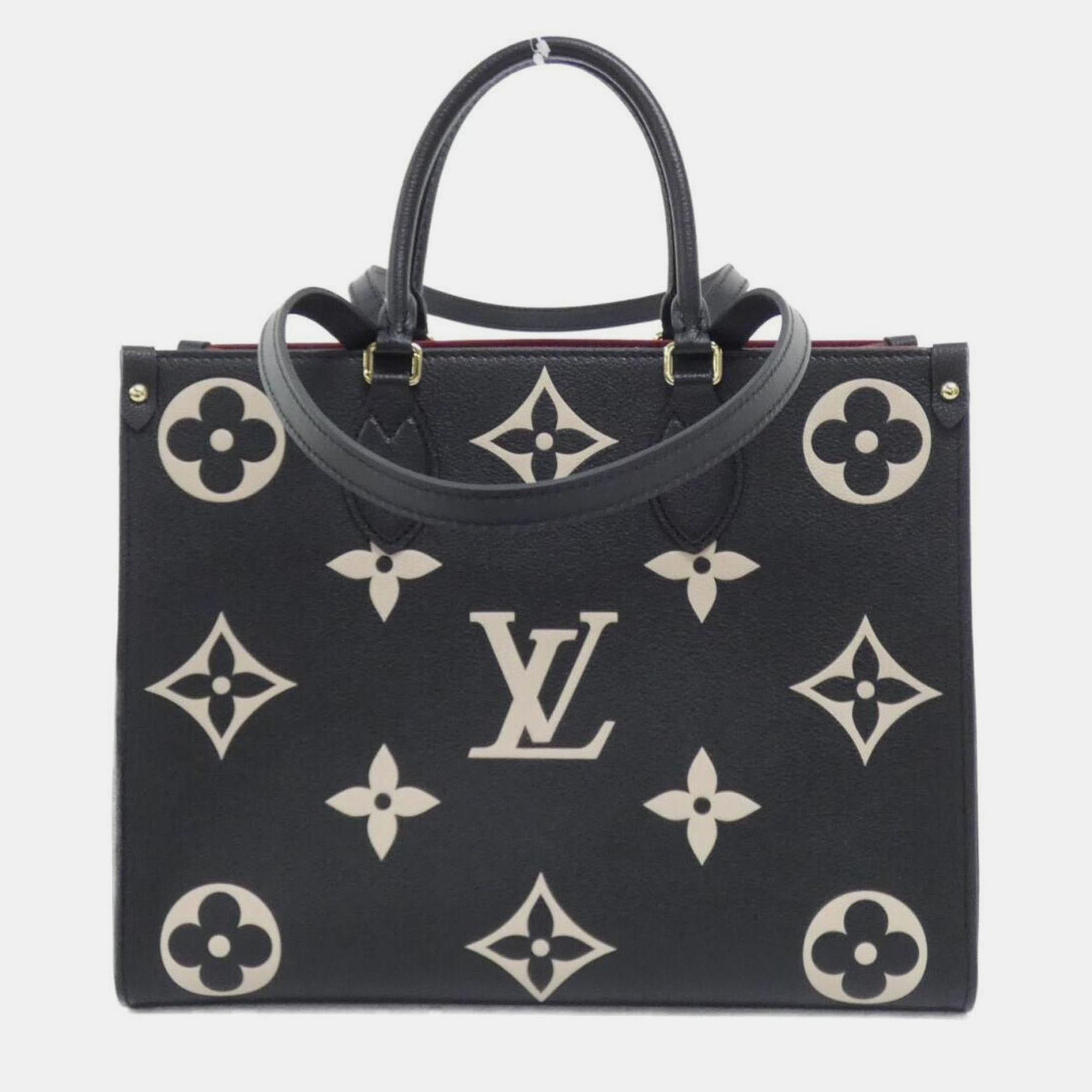 

Louis Vuitton Two-Tone Monogram Empreinte On-The-Go Mm Handbag, Beige