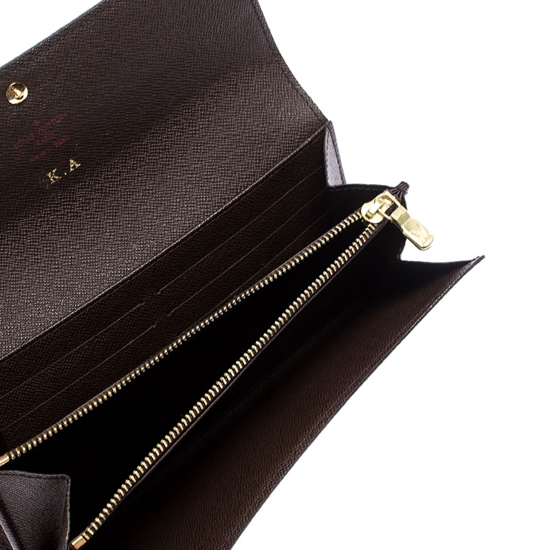 

Louis Vuitton Damier Ebene Canvas Sarah Wallet, Brown