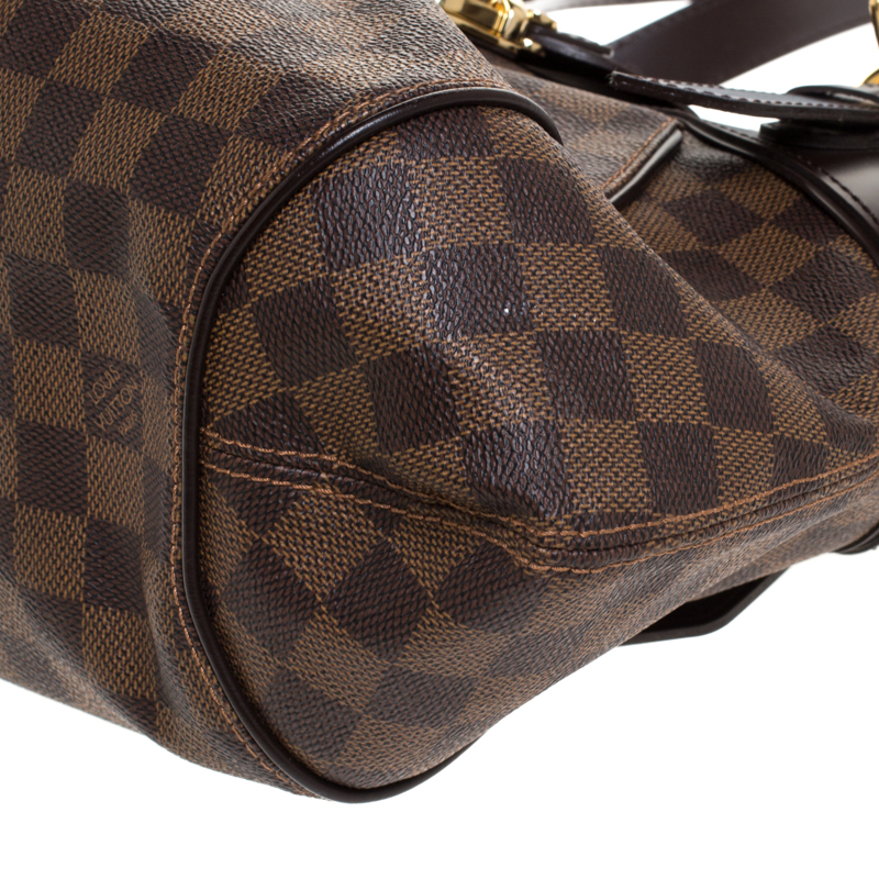 A Louis Vuitton Damier Ebene Sistina PM Bag. Brown checked canvas with  brown leather and gilded hard