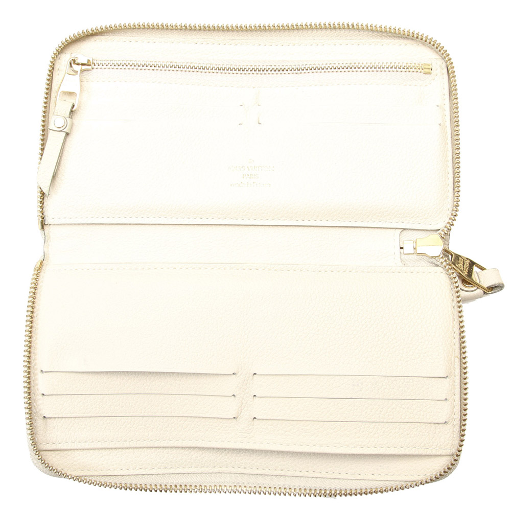 

Louis Vuitton Brown Monogram Empreinte Canvas Zippy Wallet, Beige
