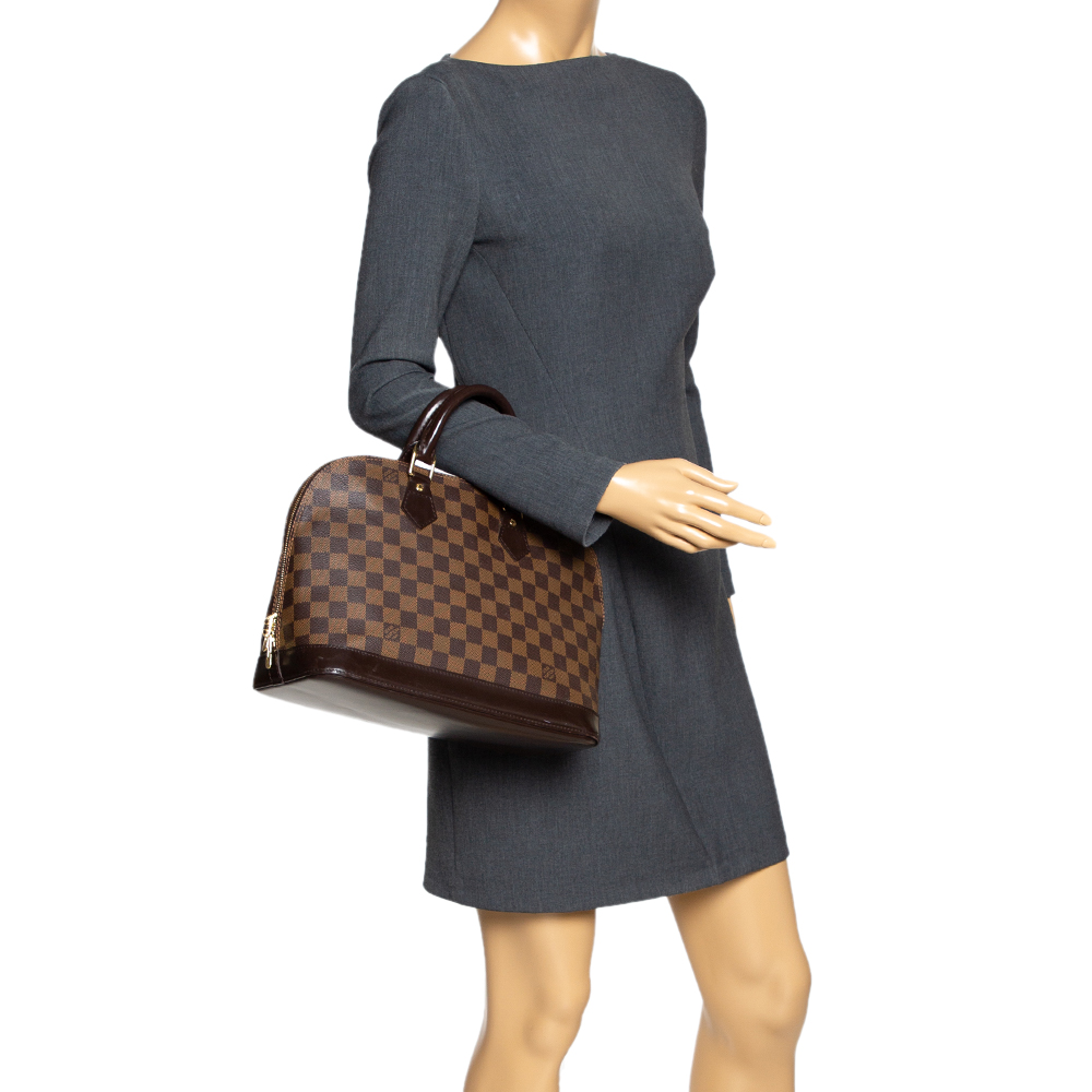 

Louis Vuitton Damier Ebene Canvas Alma PM Bag, Brown