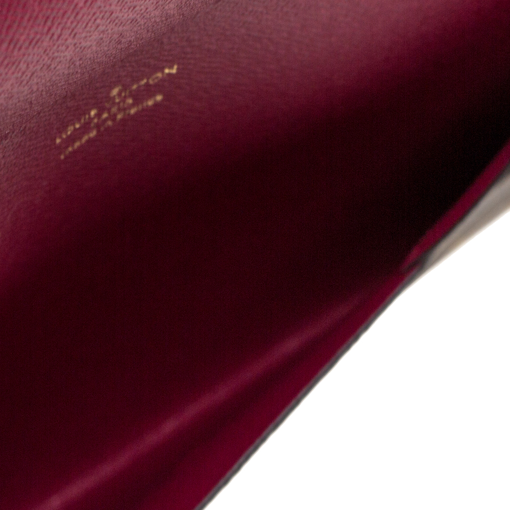 

Louis Vuitton Monogram Canvas Rivets Envelope MM Clutch, Brown