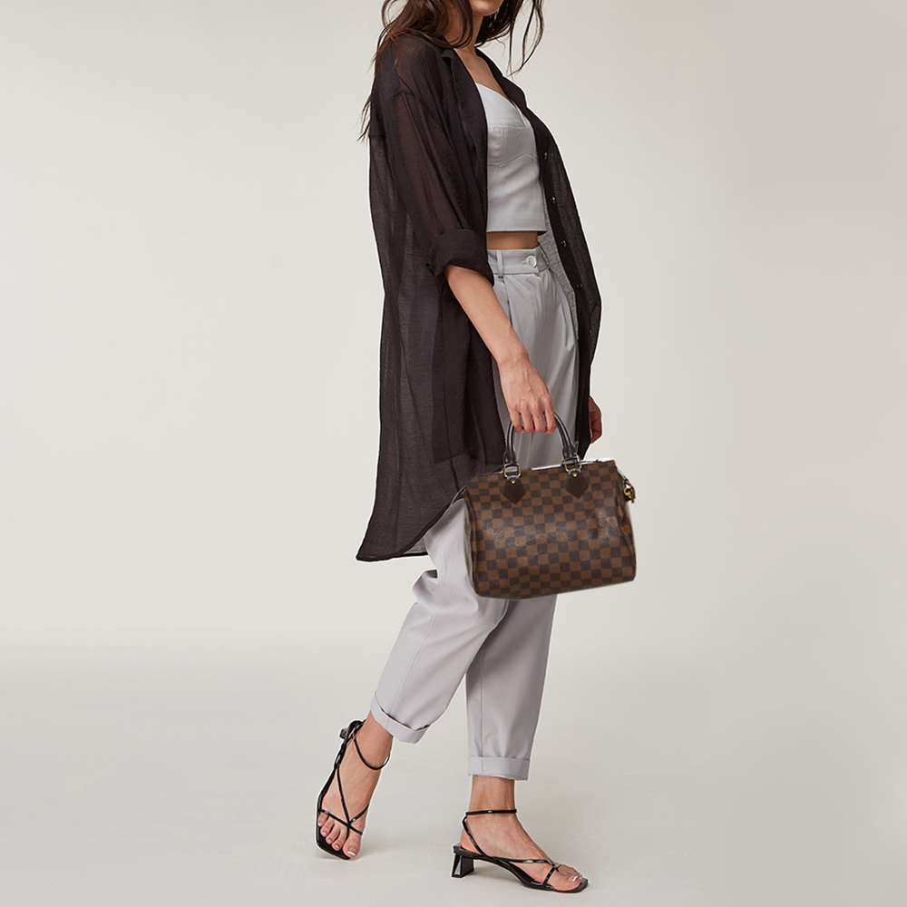 

Louis Vuitton Damier Ebene Canvas Speedy 25 Bag, Brown