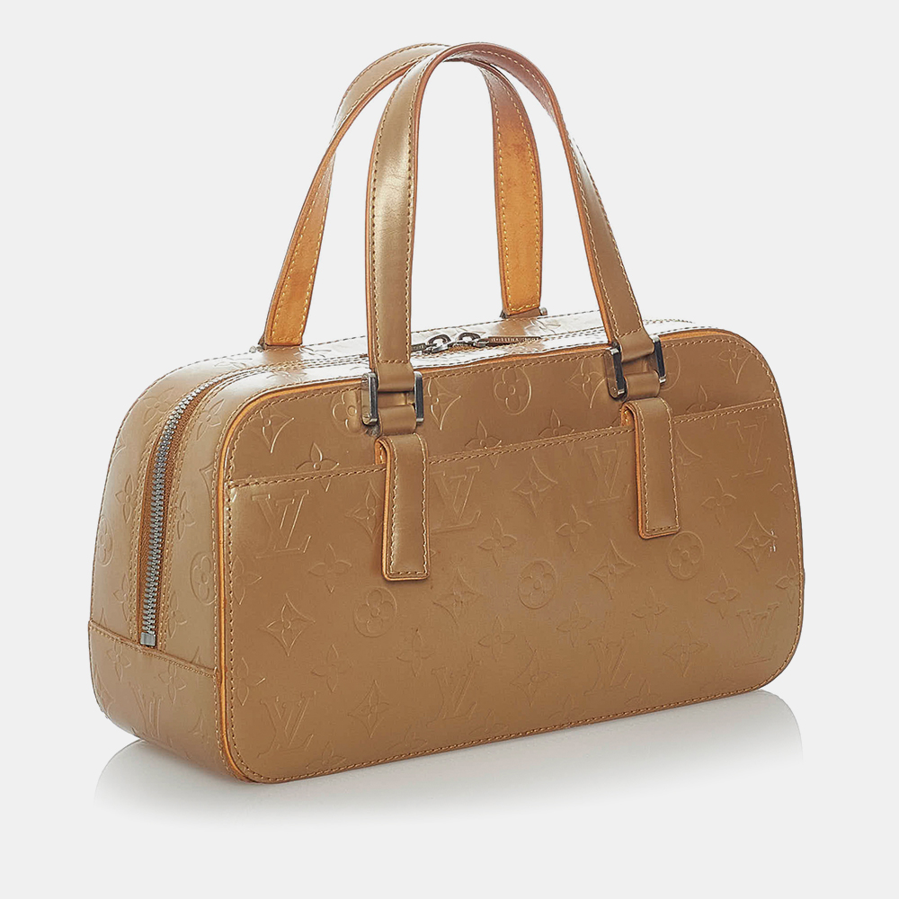 

Louis Vuitton Gold Monogram Mat Shelton