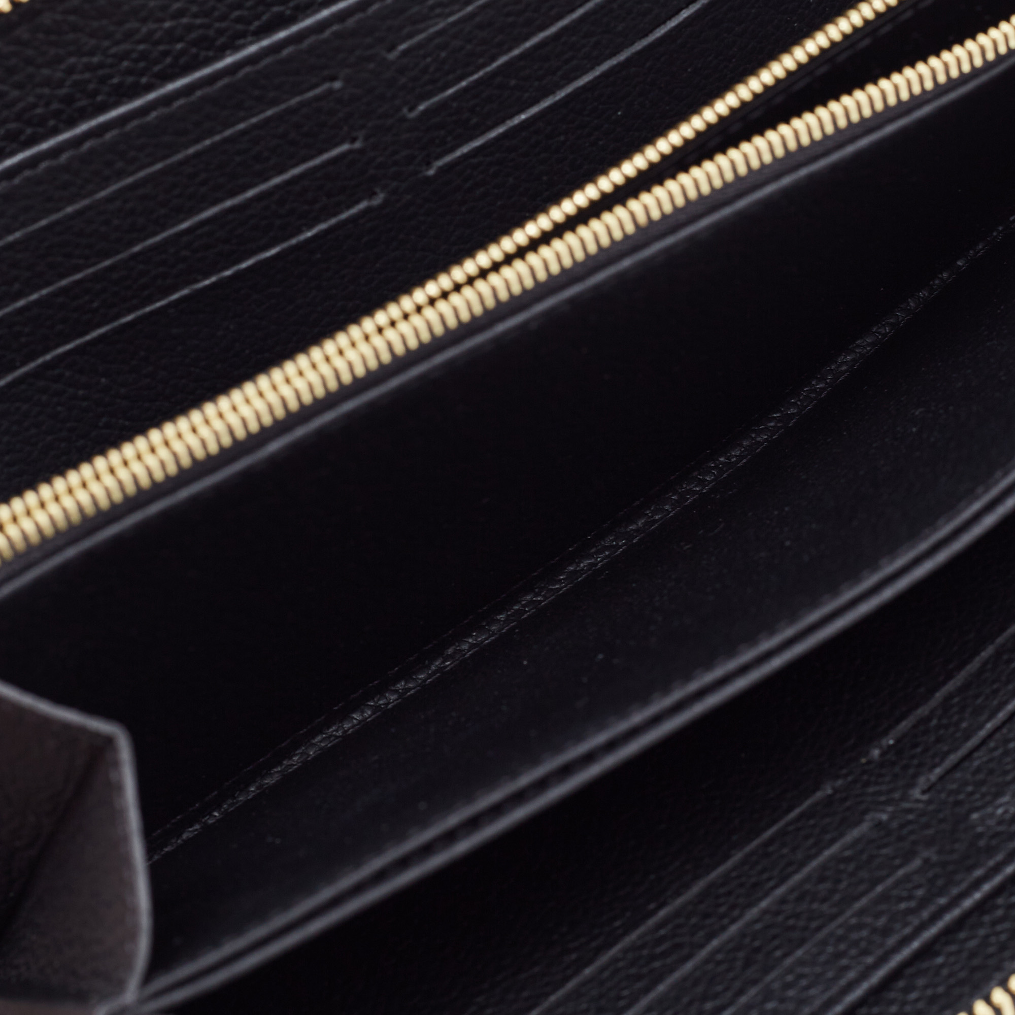 

Louis Vuitton Black Monogram Empreinte Leather Zippy Wallet