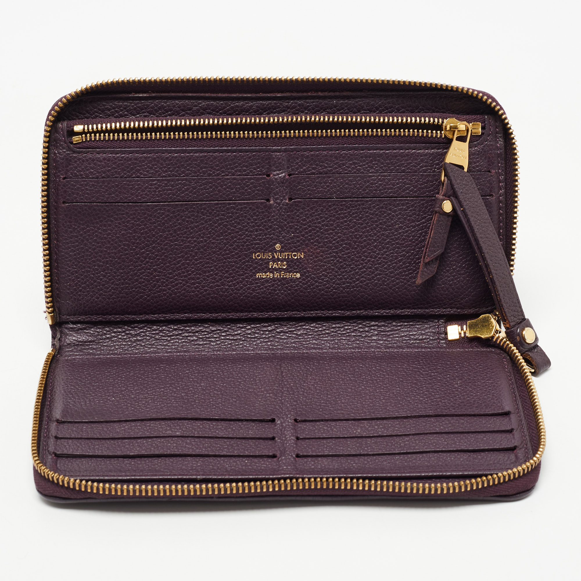 

Louis Vuitton Grenat Monogram Empreinte Leather Zippy Wallet, Purple