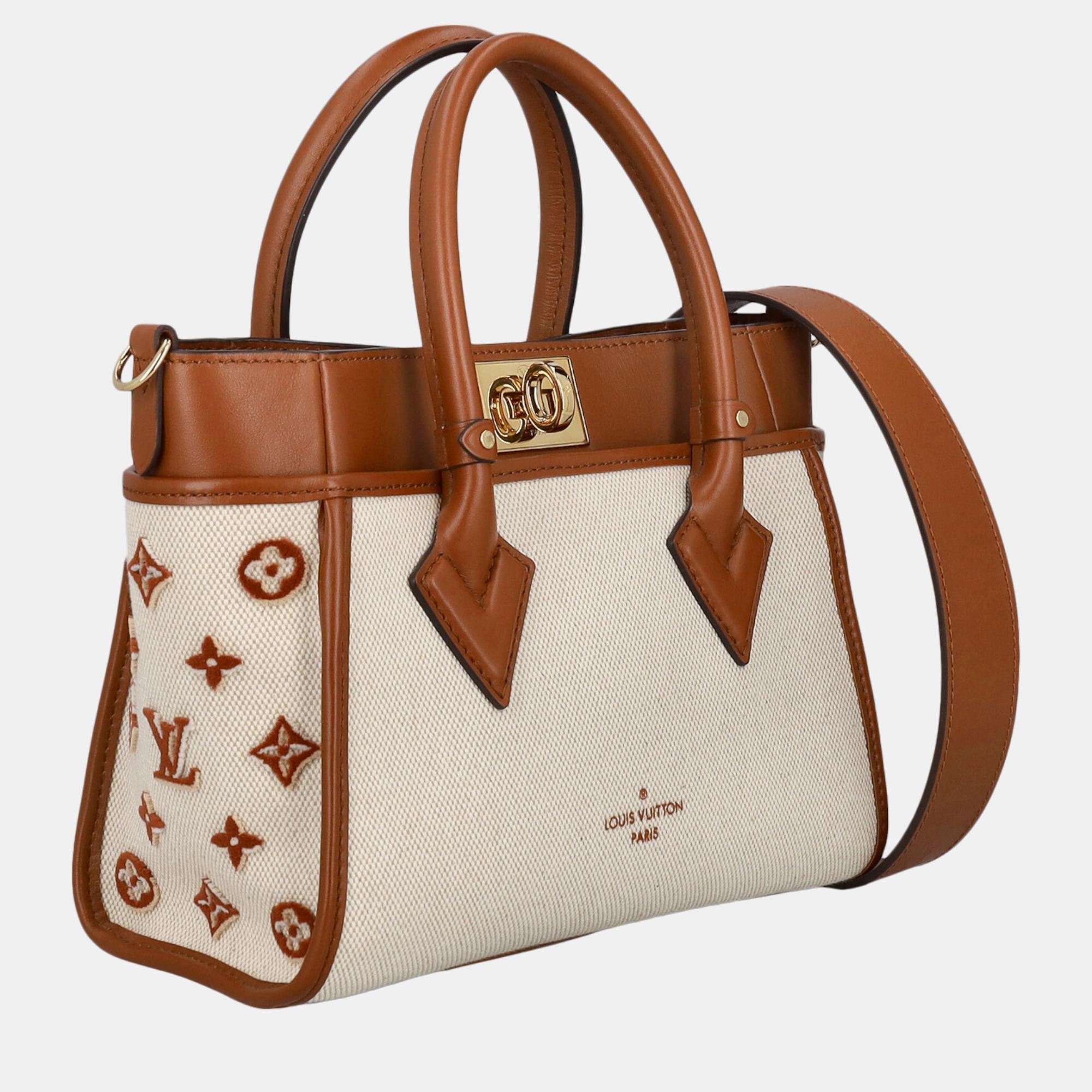 

Louis Vuitton Women's Fabric Handbag - Camel Color, Beige