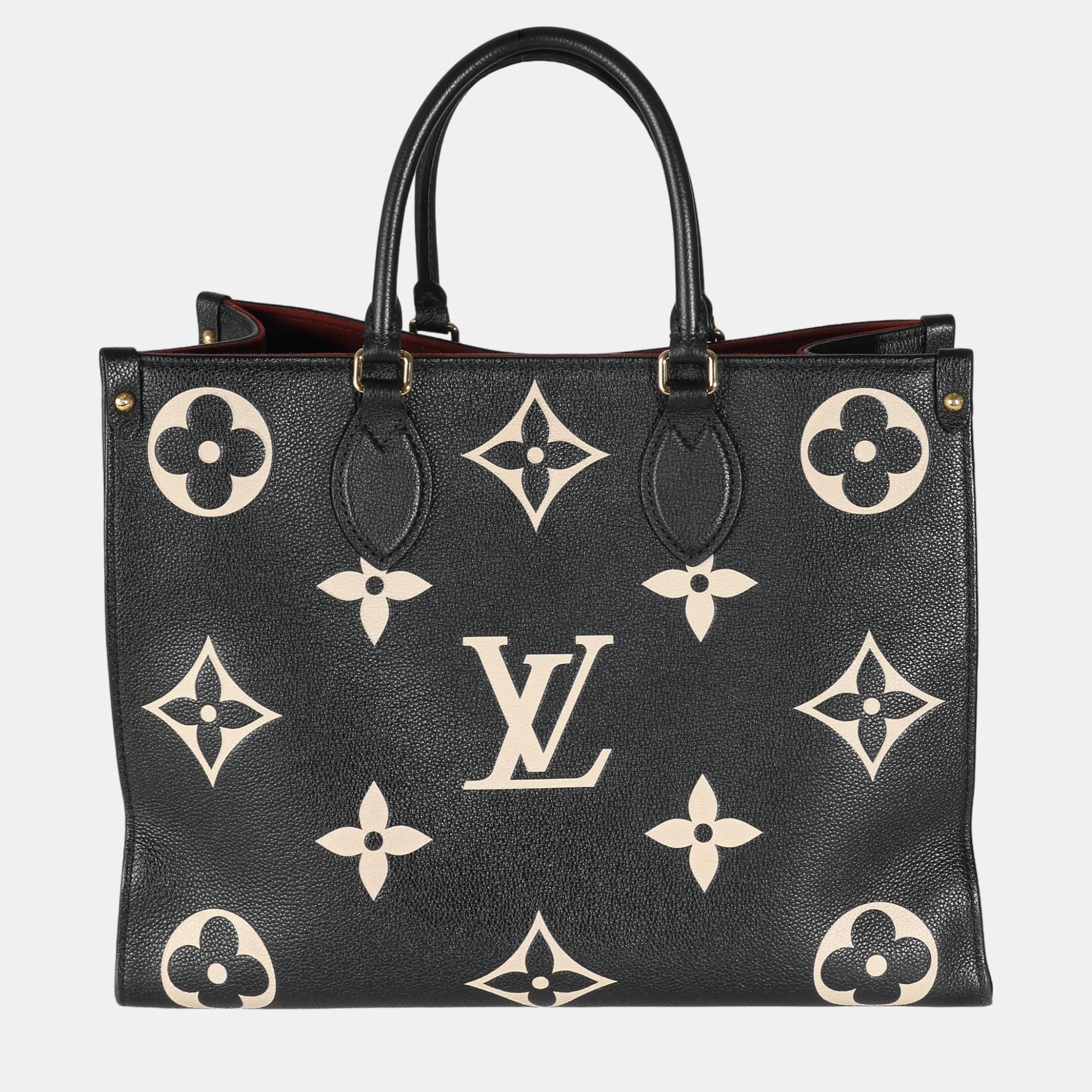 

Louis Vuitton Black Cream Monogram Giant Empreinte Onthego MM bag