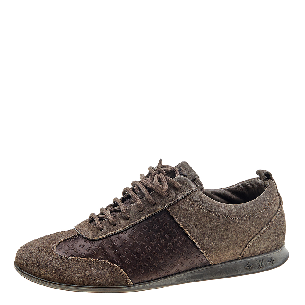 A pair that will see you through a long day in full comfort Crafted using suede and monogram satin these Louis Vuitton sneakers are designed in a low top style secured with lace ups and set atop durable rubber soles.