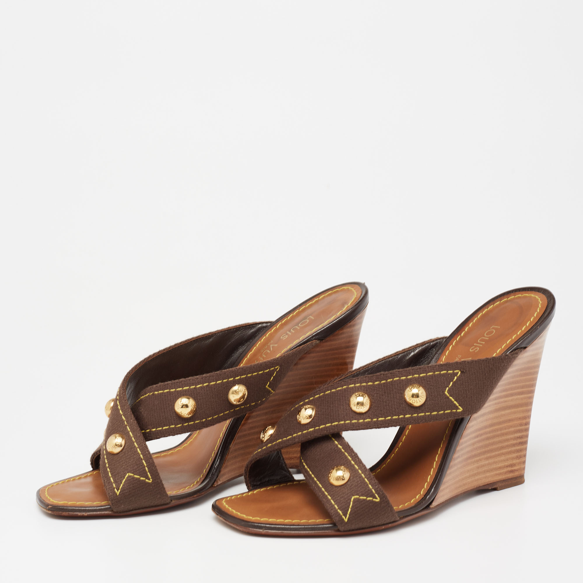 

Louis Vuitton Brown Canvas Studded Cross Strap Wedge Sandals Size