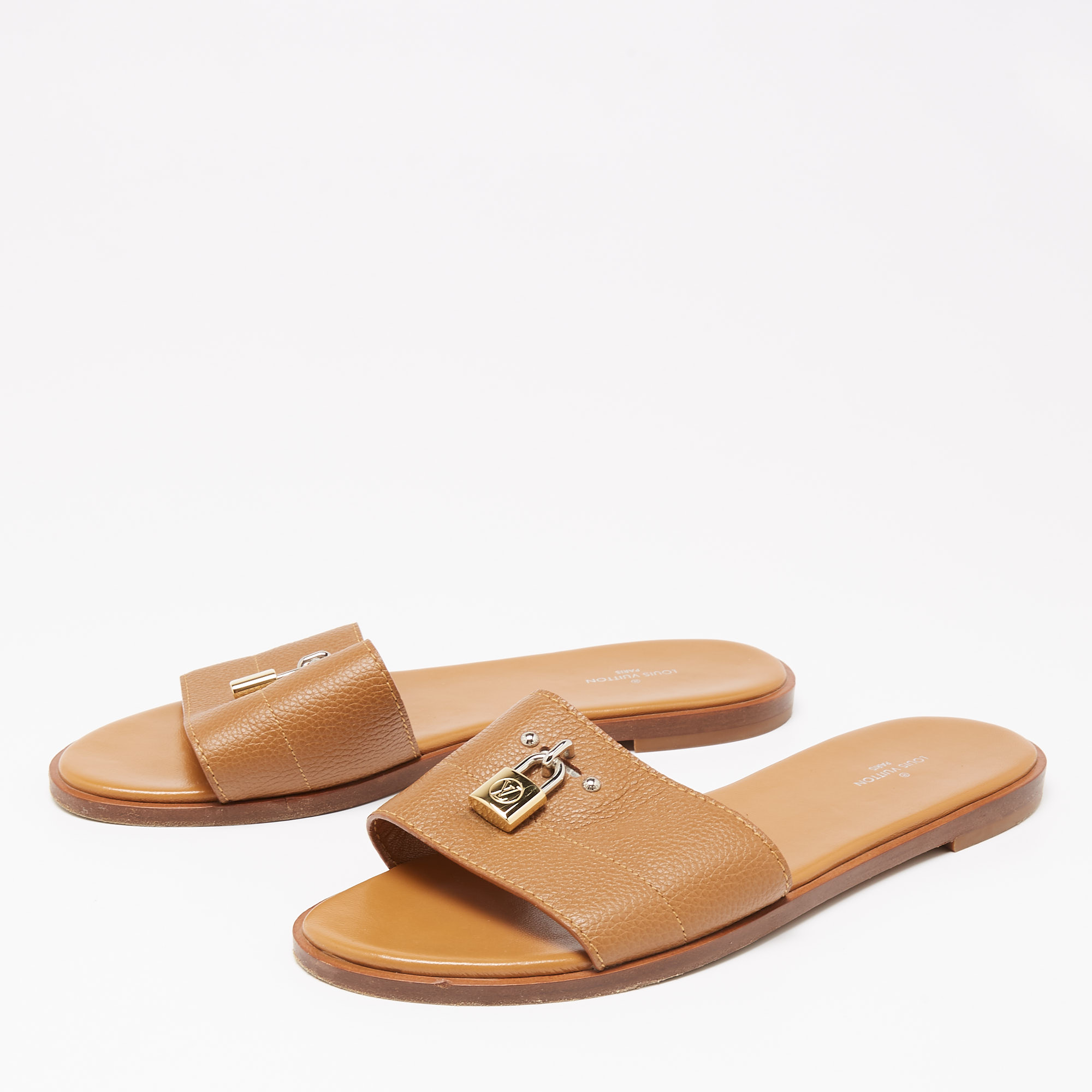 

Louis Vuitton Brown Grained Leather Lock It Flat Slides Size