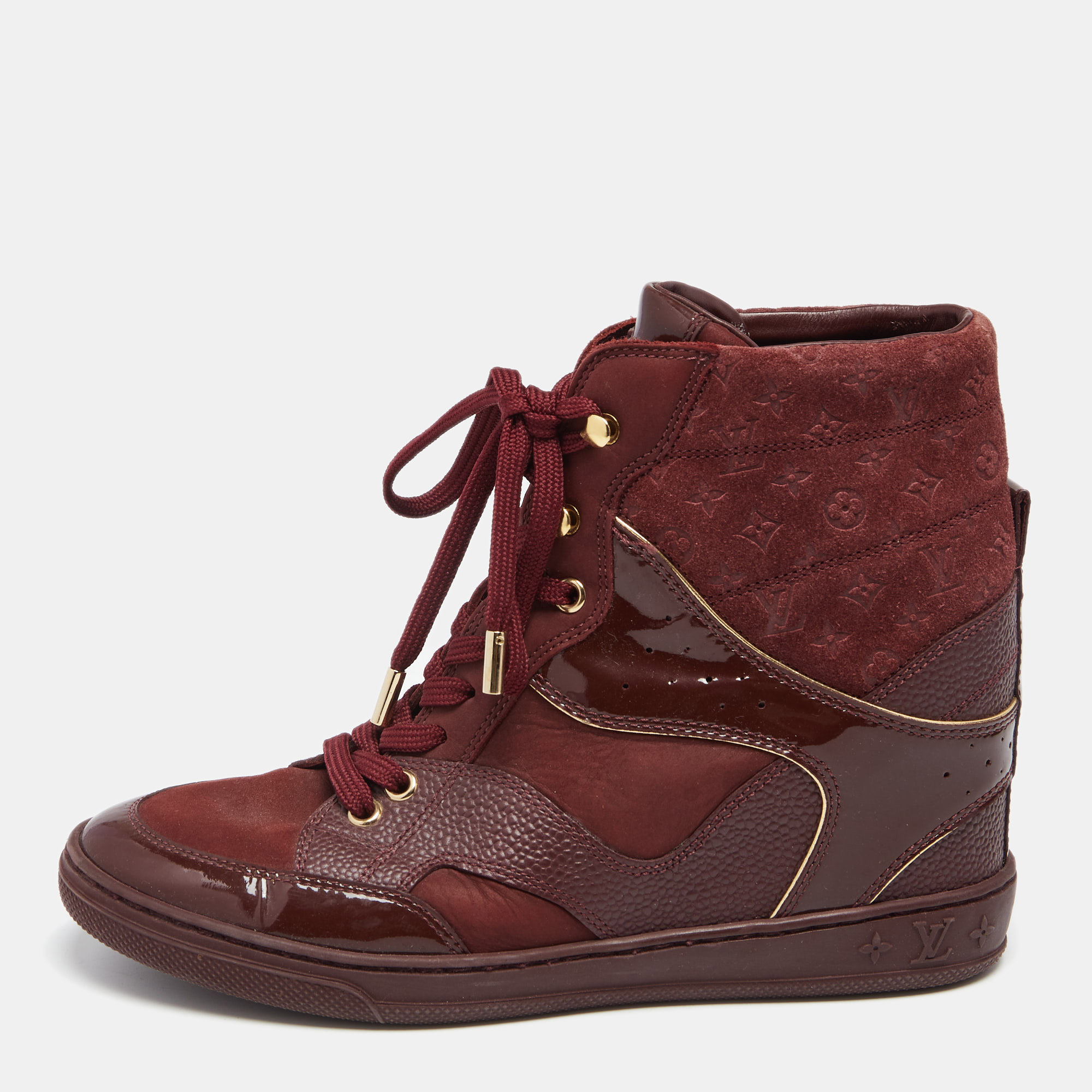 Presenting a sporty design thats blended with the LV touch of luxury. These wedge sneakers for women are crafted beautifully using quality materials and are set on wedge heels. Lace up closure and monogram embossing lend the perfect finish.