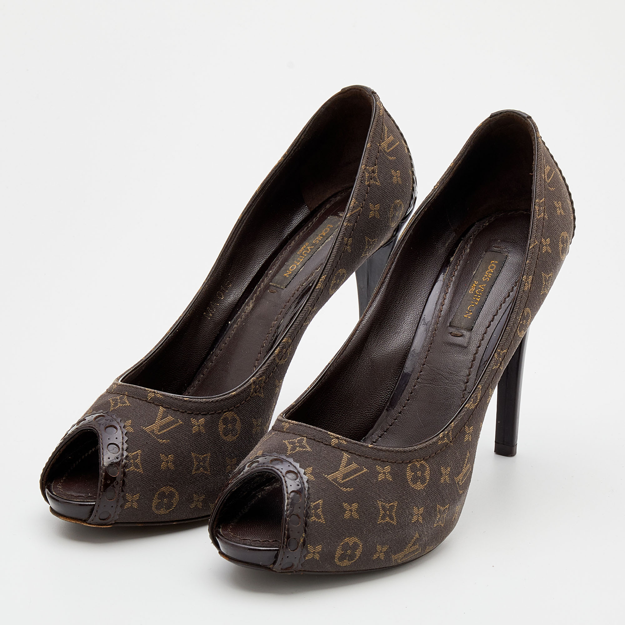 

Louis Vuitton Brown Patent Leather and Monogram Mini Lin Canvas Peep Toe Pumps Size