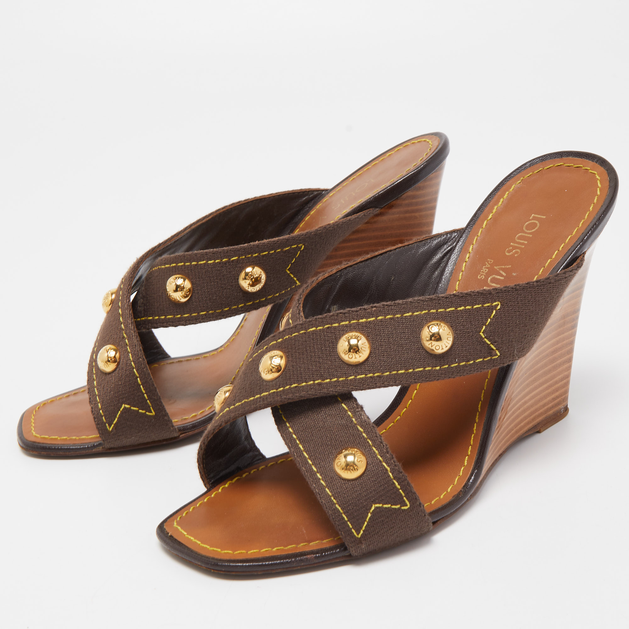 

Louis Vuitton Brown Canvas Studded Cross Strap Wedge Sandals Size