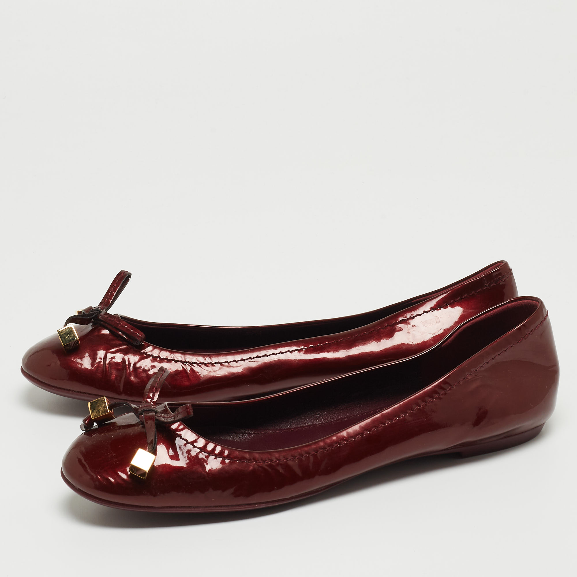 

Louis Vuitton Burgundy Patent Dice Ballet Flats Size