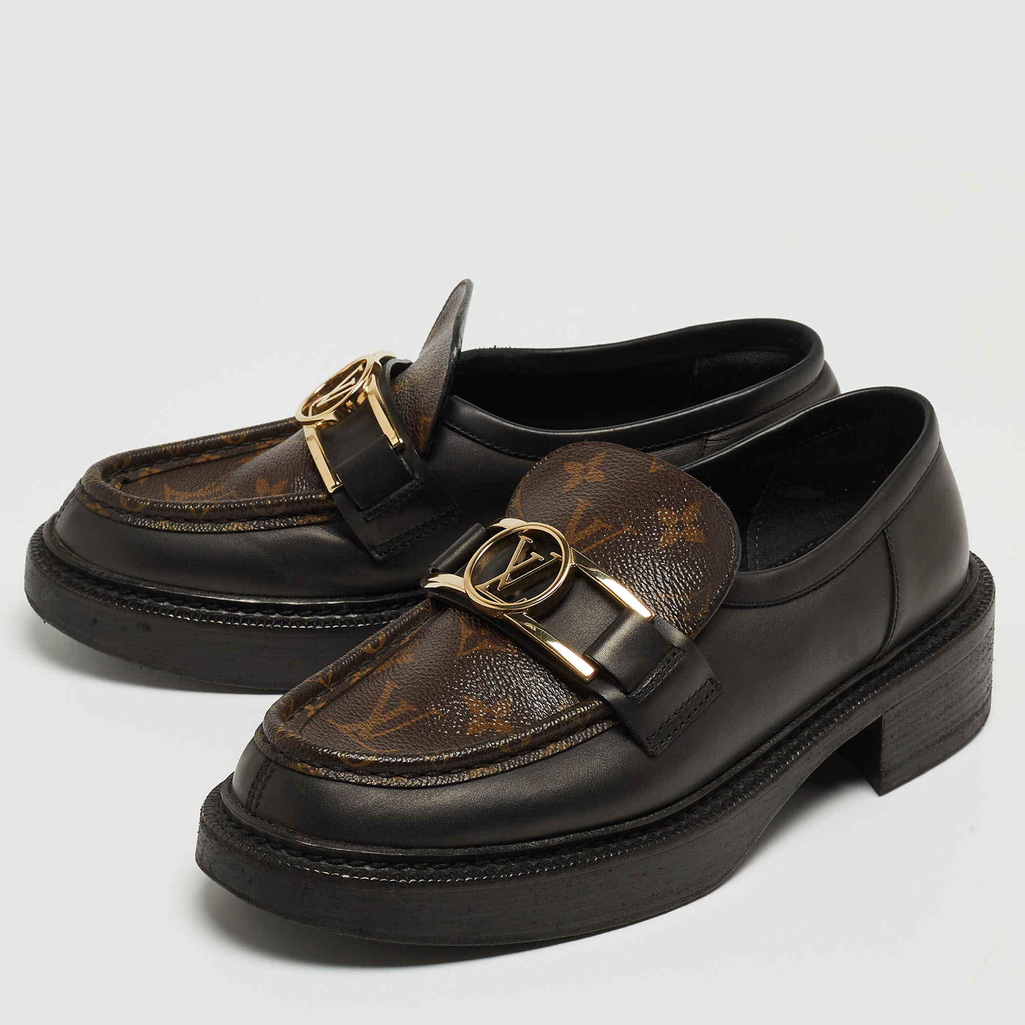 

Louis Vuitton Brown/Black Monogram Canvas and Leather Loafers Size