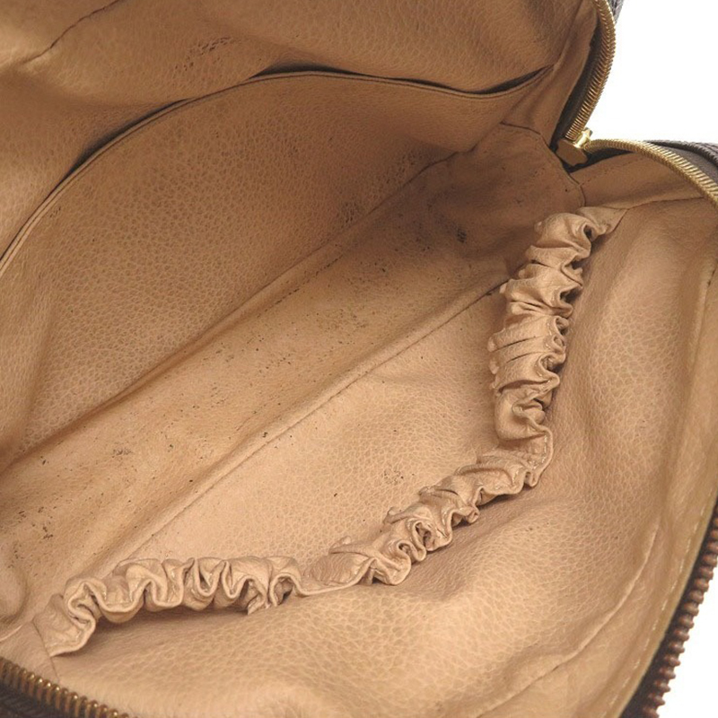 

Louis Vuitton Monogram Canvas Trousse Toilette 23, Brown