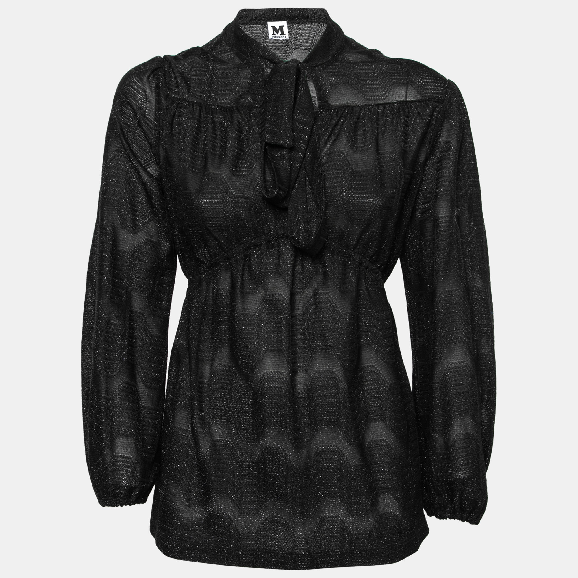This top from M Missoni is all about sporting a classy and elegant style. It is tailored from black patterned lurex knit fabric and comes with a neck tie detail and long sleeves. You can wear it with light trousers and tall heels for an evening occasion. This classy top is all set to become a part of your wardrobe.