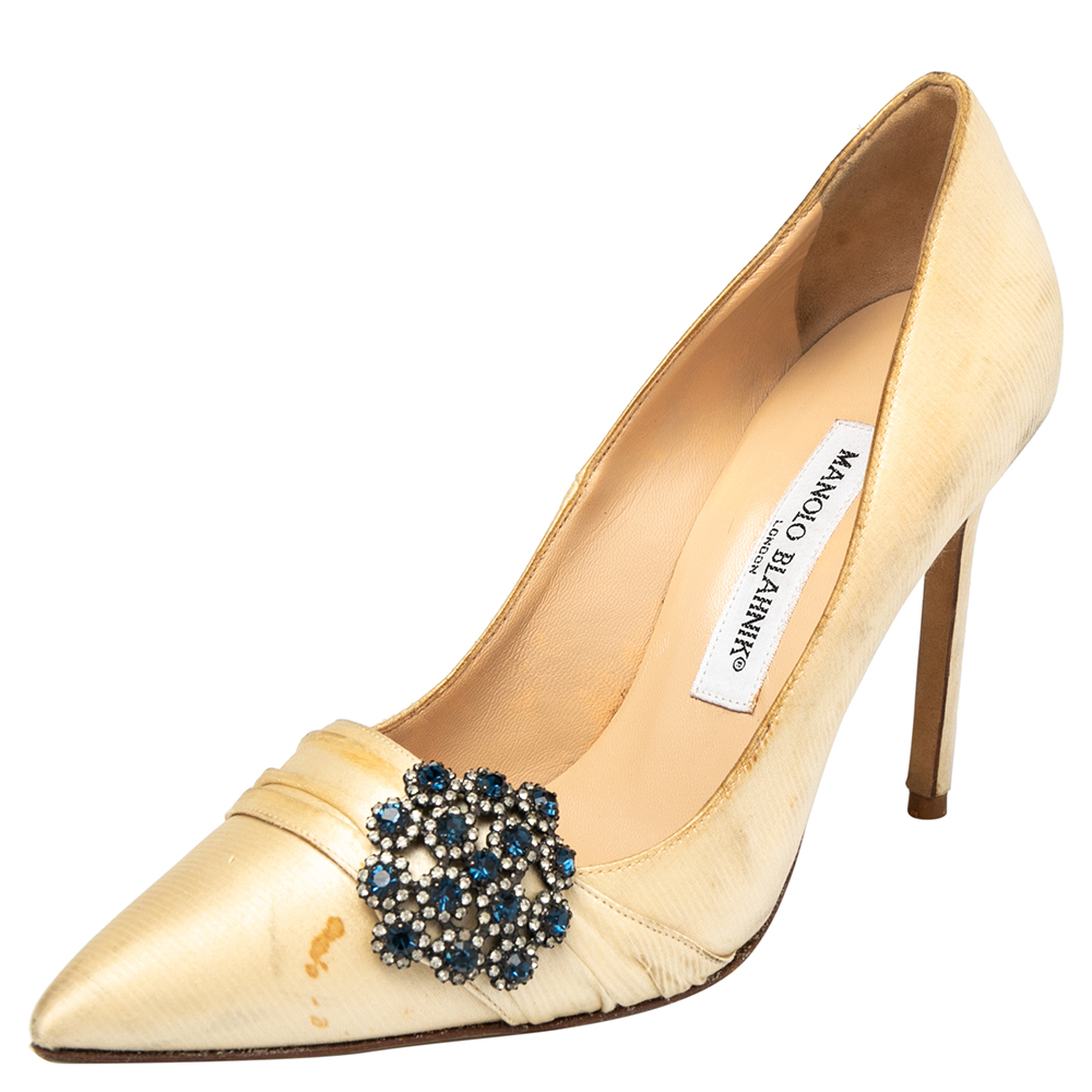 Manolo Blahnik is well known for his graceful designs and his label is synonymous with opulence femininity and elegance. These pumps are crafted from satin into a pointed toe silhouette augmented by the embellishments perched on the uppers. They are elevated on high heels and can amp up your look instantly.