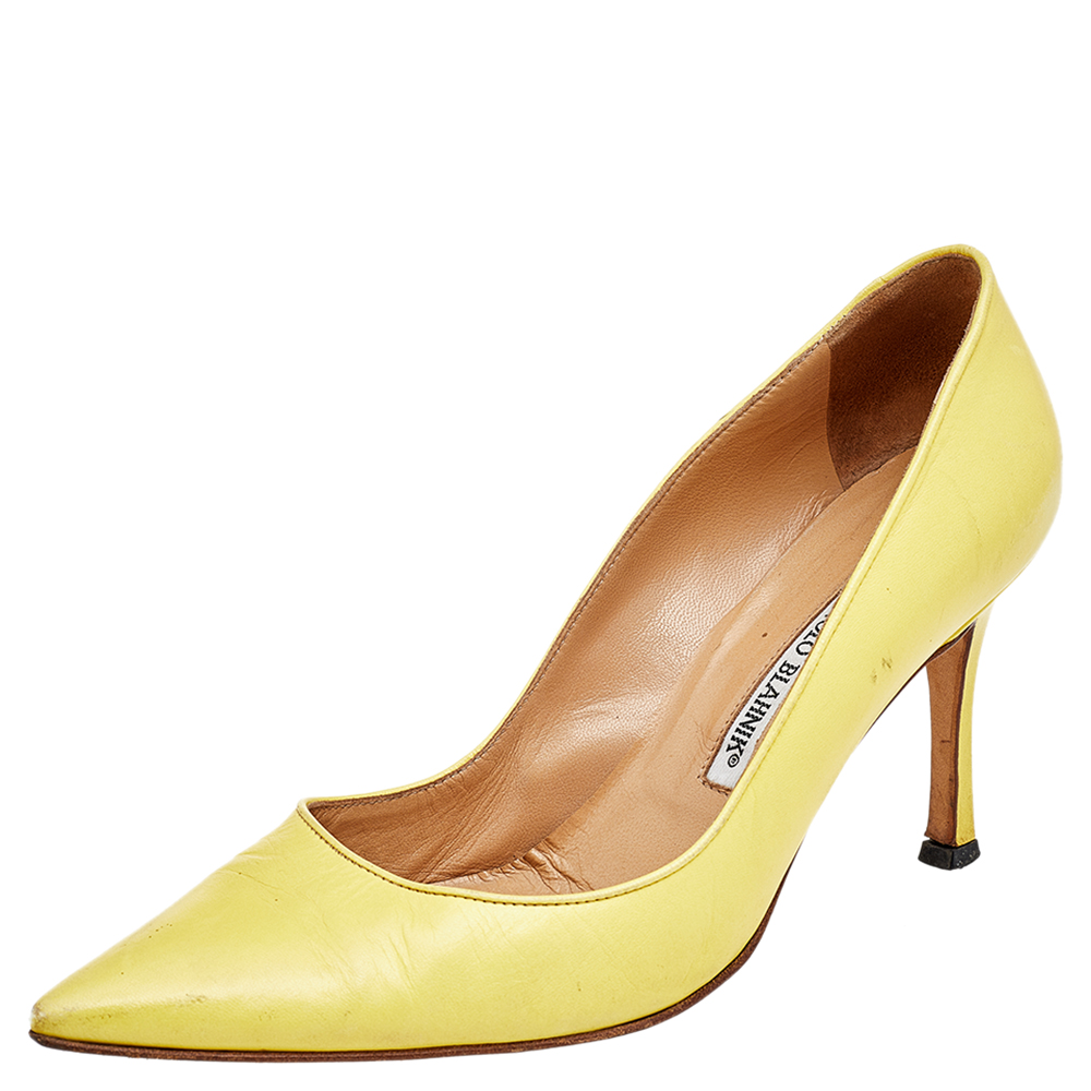 There are some shoes that stand the test of time and fashion cycles these timeless Manolo Blahnik pumps are the one. Crafted from leather in a yellow shade they are designed with sleek cuts pointed toes and slender heels.