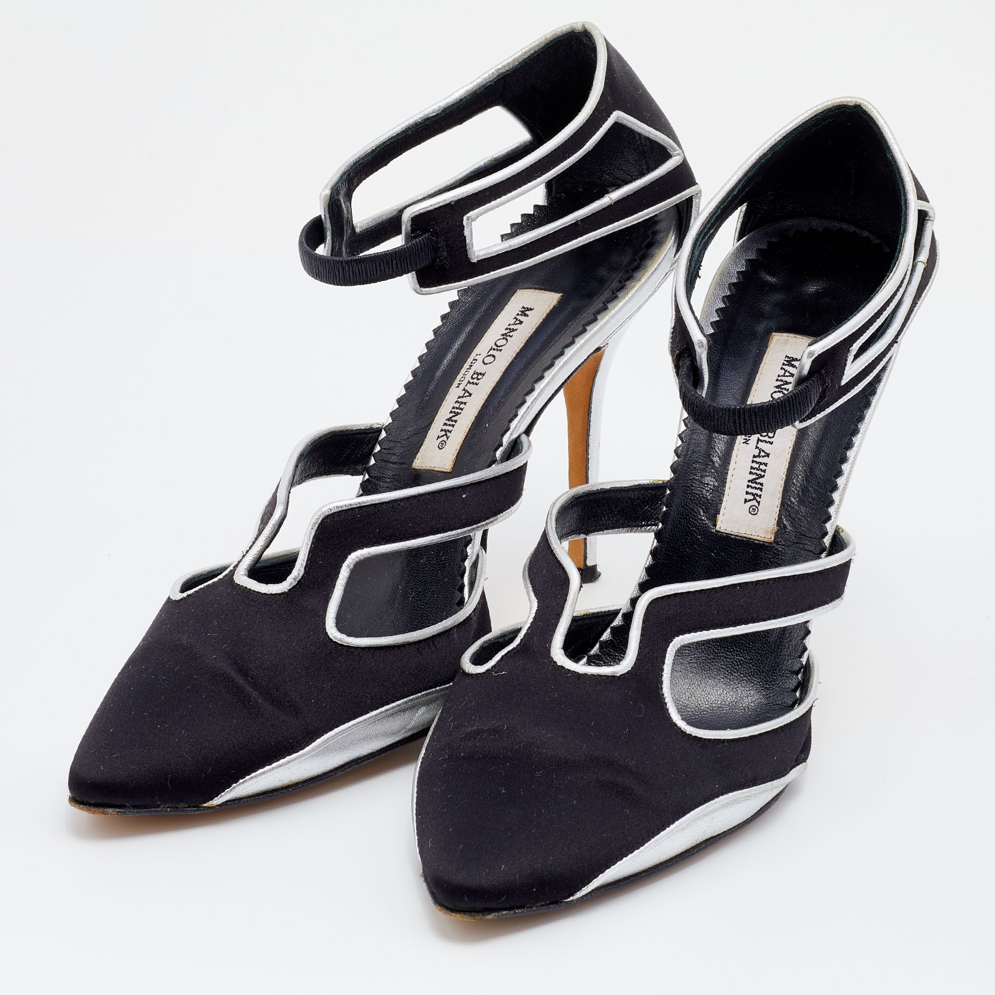 

Manolo Blahnik Black/Silver Satin And Leather Cut Out Pumps Size