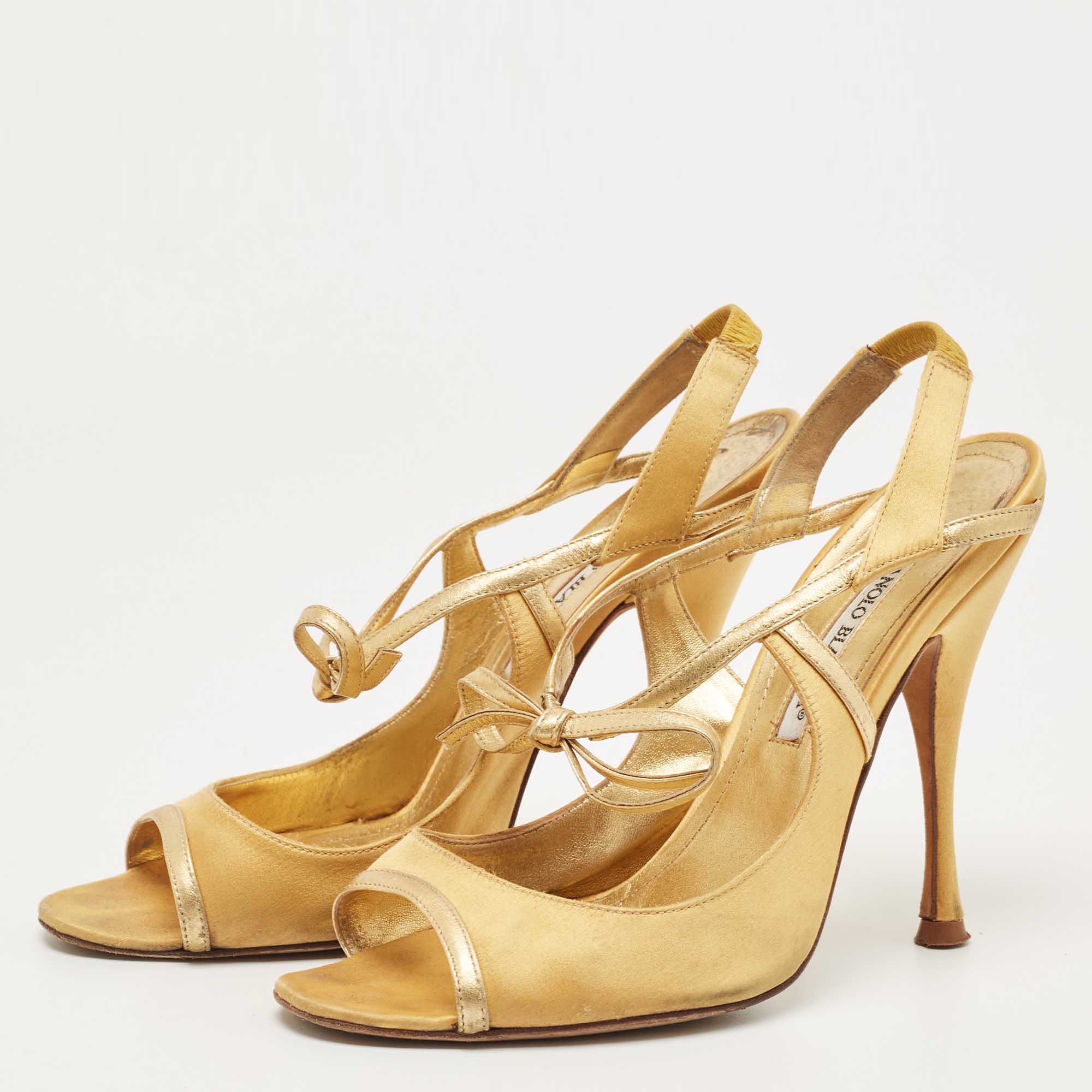 

Manolo Blahnik Gold Satin and Leather Slingback Sandals Size