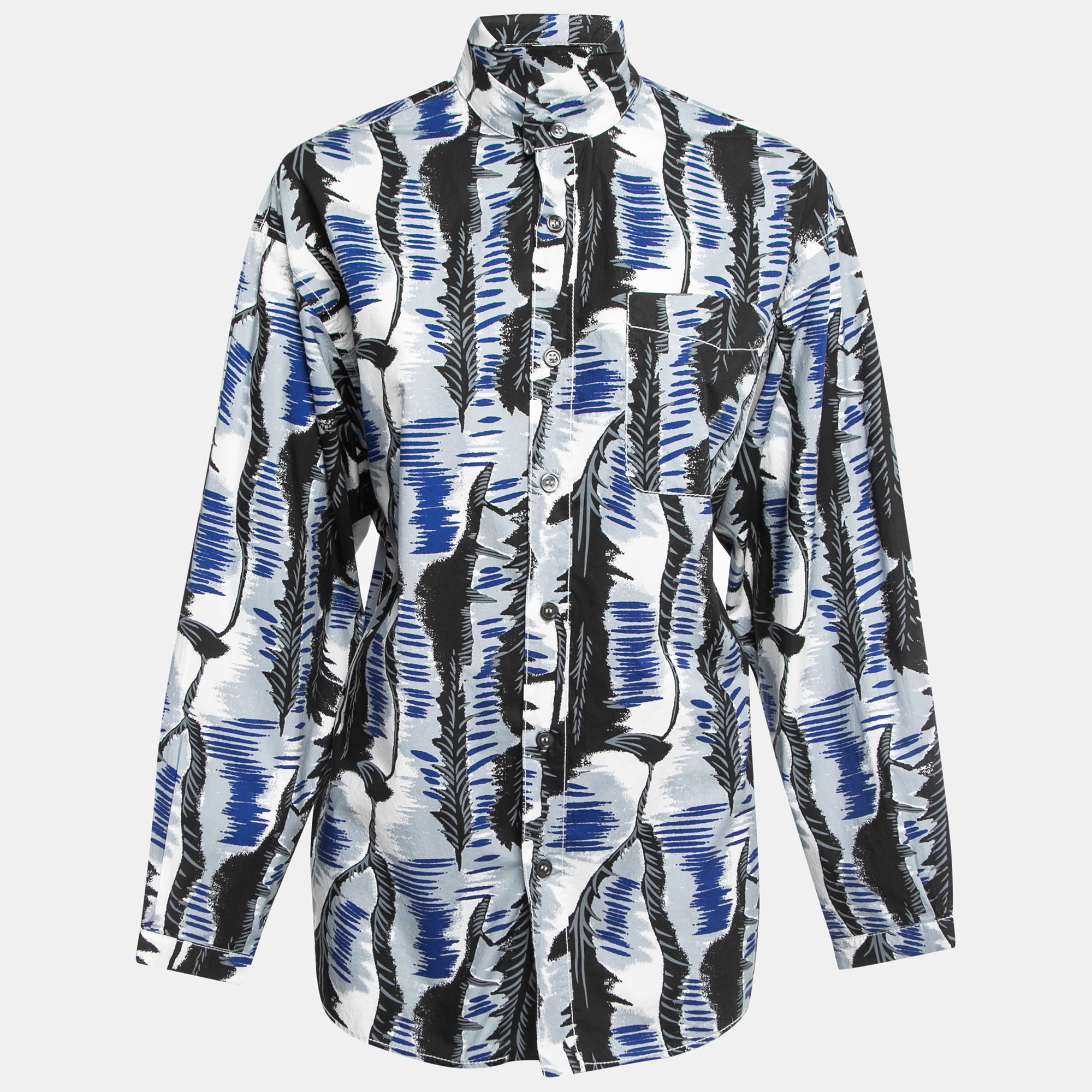 The Marni shirt is a stylish and versatile piece. Made from soft cotton fabric it features a unique blue and black print. The shirt has a button front closure and full sleeves providing a relaxed and oversized fit. Its a perfect addition to any fashion forward wardrobe.