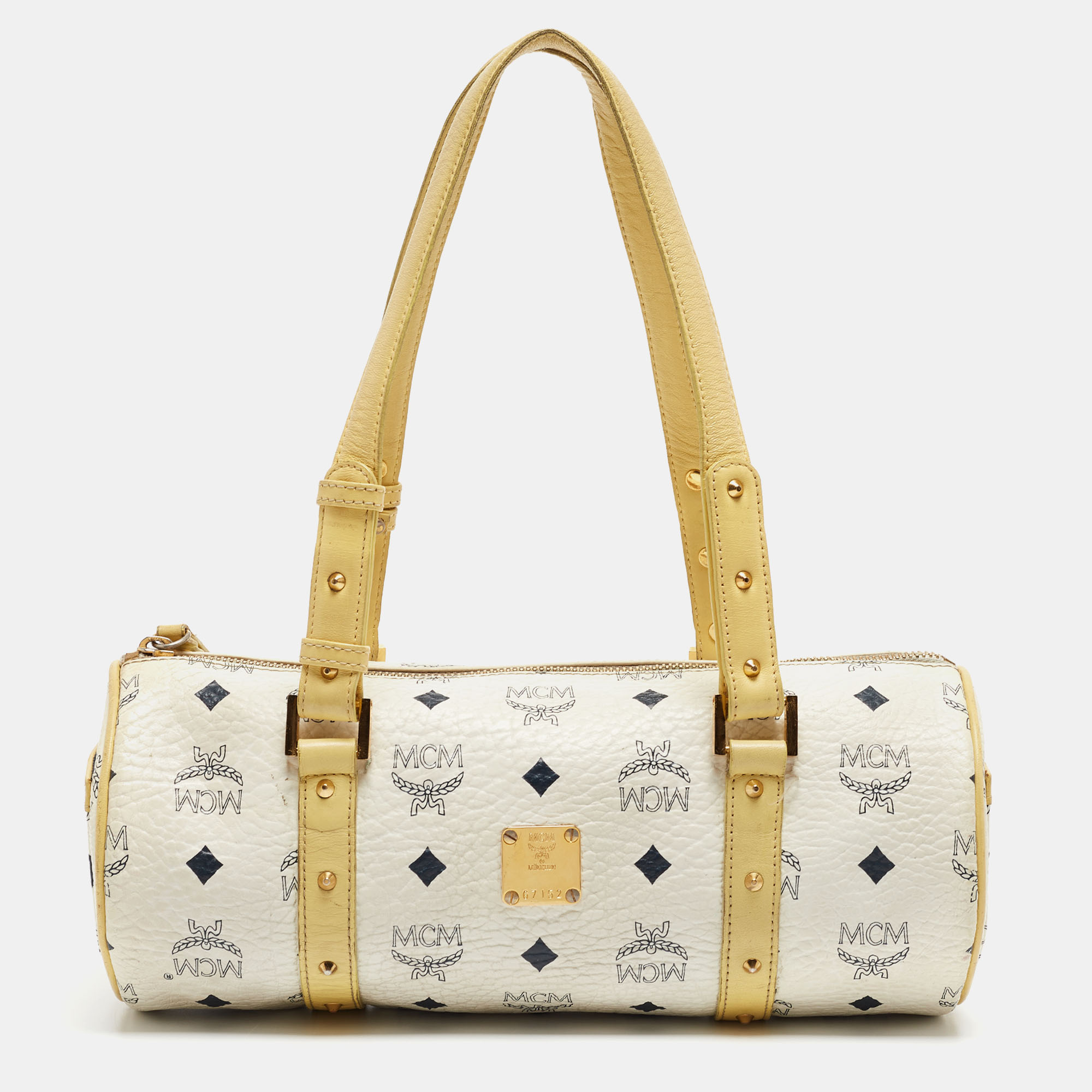 Indulge in timeless luxury with this MCM bag. Meticulously crafted this iconic piece combines heritage elegance and craftsmanship elevating your style to a level of unmatched sophistication.