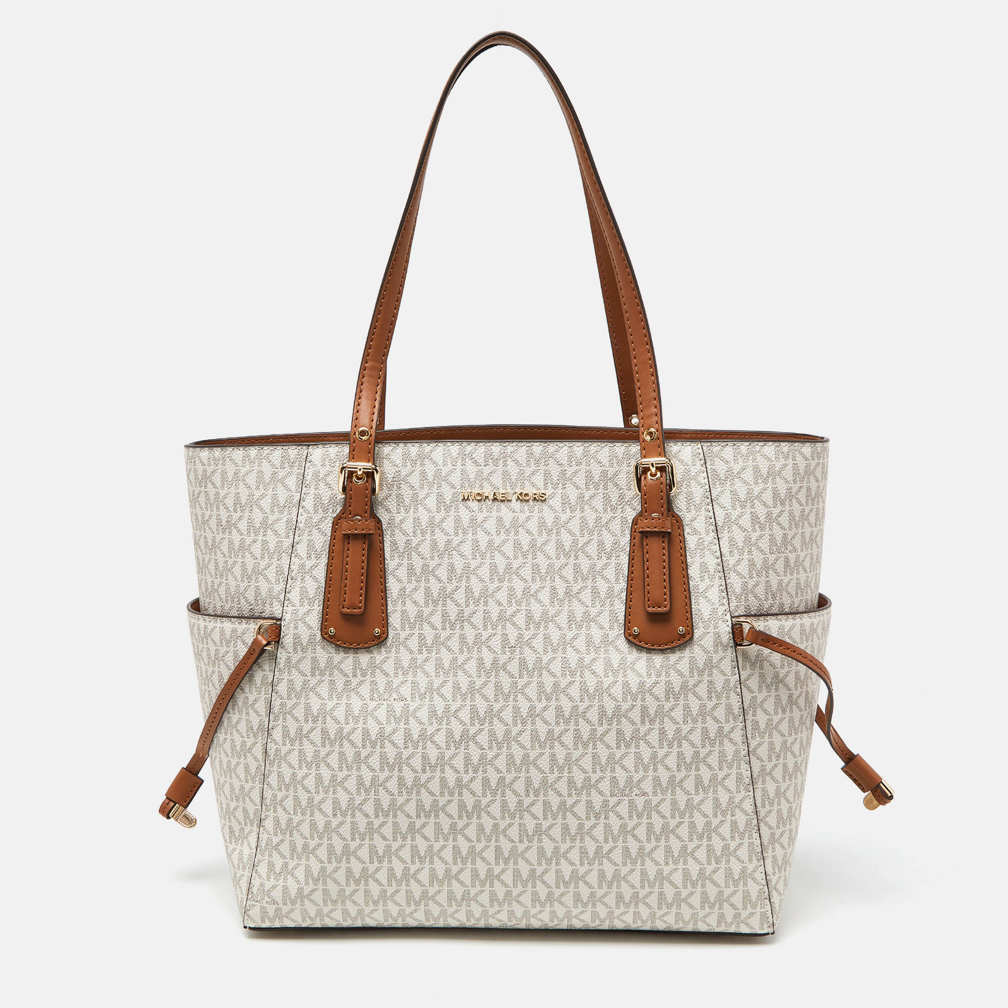 

Michael Kors Cream/Tan Signature Coated Canvas and Leather Voyager Tote, Beige