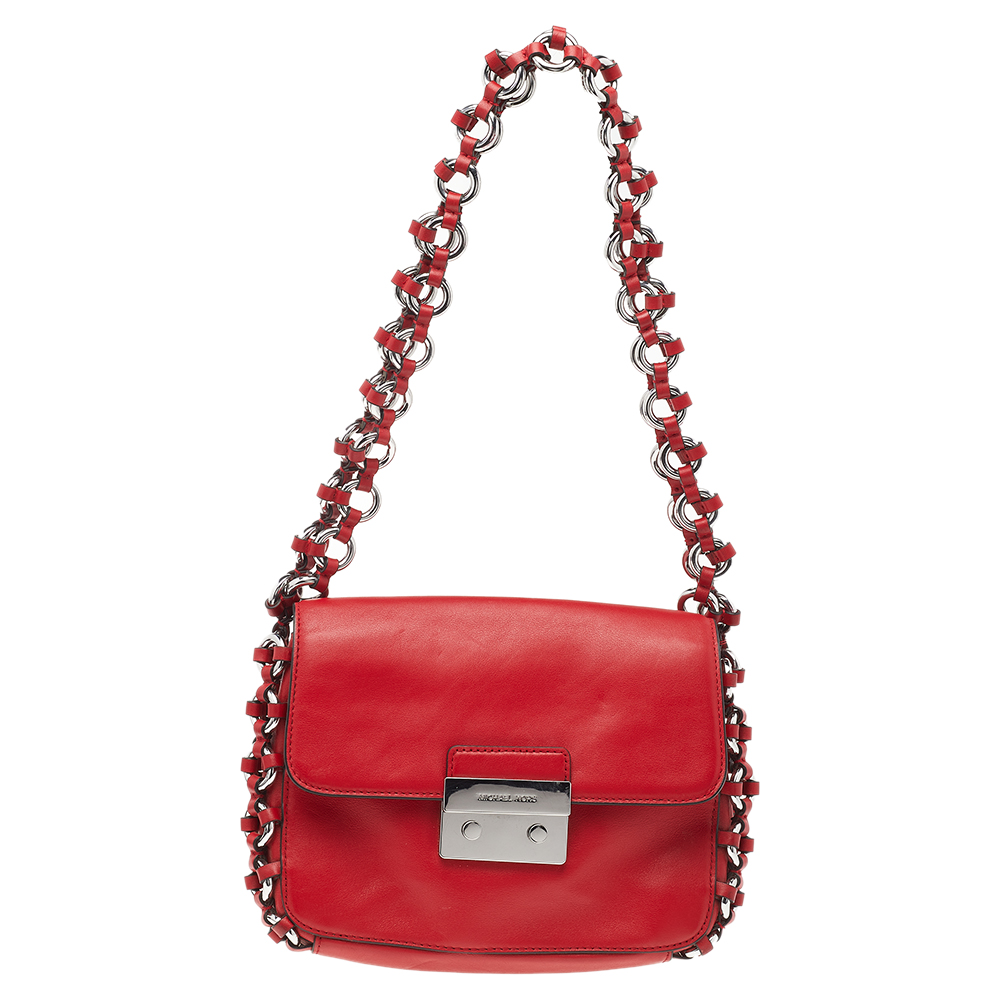 The perfect design of this Michael Kors bag ensures a gorgeous finish and an uptown appeal. it has been crafted from red hued leather and carries lovely hardware detailing. The front flap opens to a nylon interior while the shoulder strap makes it easy to carry.